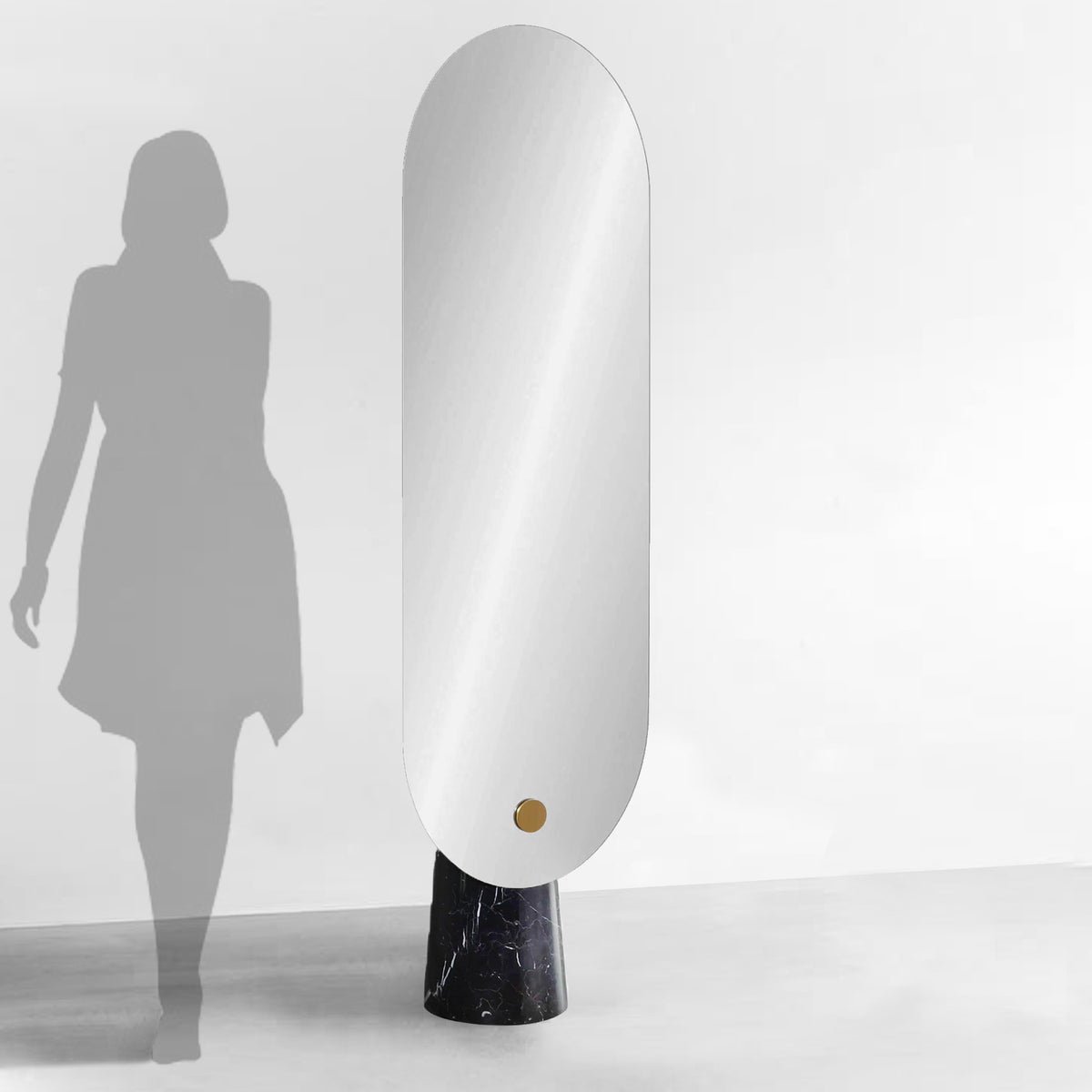 Black natural marble base mirror by BEACON featuring a sleek round glass mirror with a sturdy marble stand.