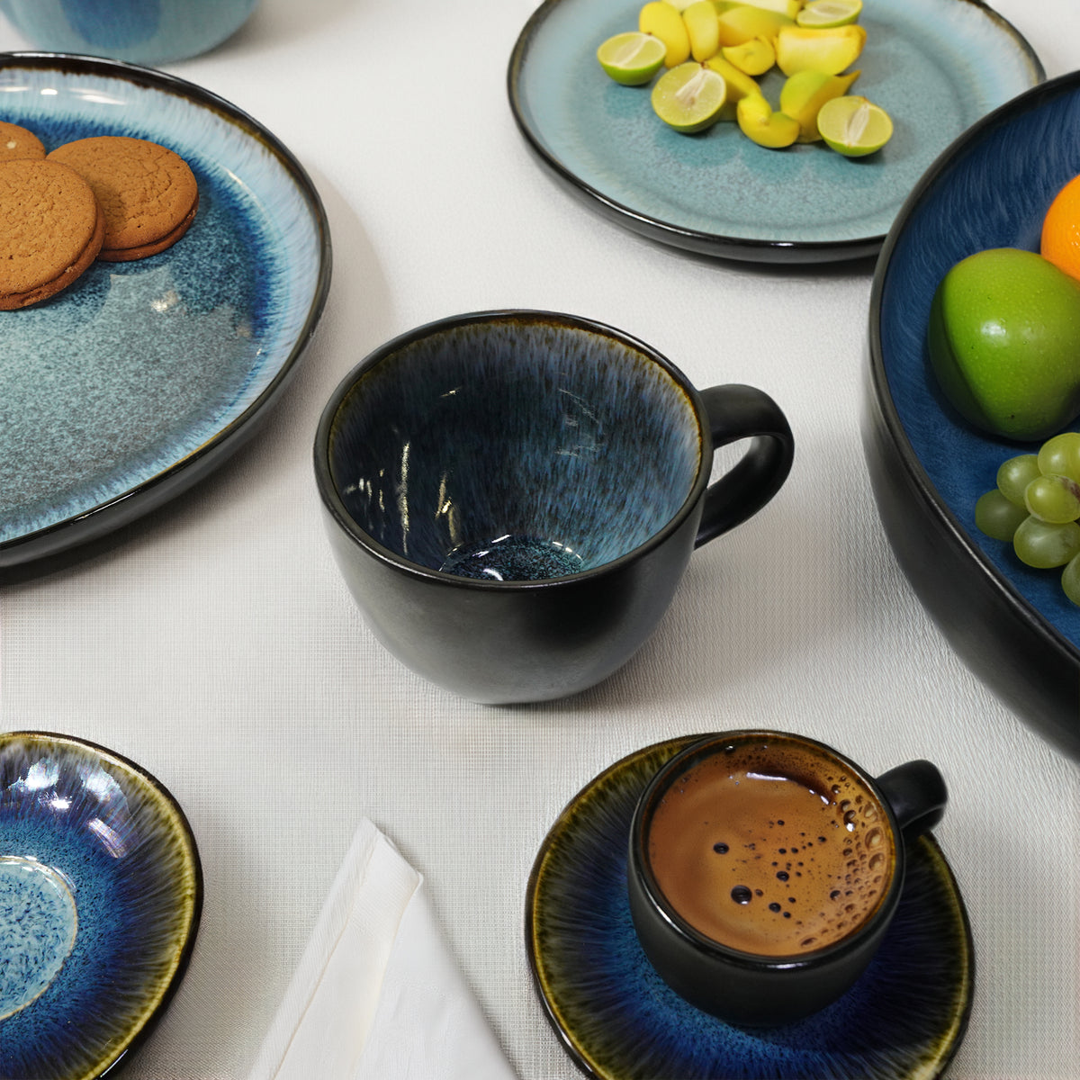 Blue wave ceramic mug from BEACON featuring black and blue design, perfect for hot beverages.