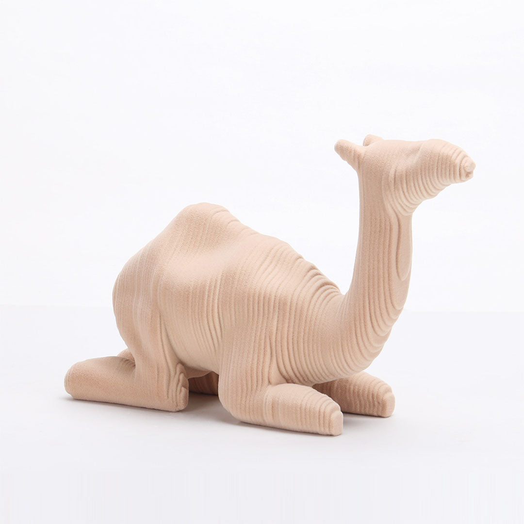 Beige ceramic camel sculpture from Beacon home decor figurines collection, detailed and stylish for interior decoration.
