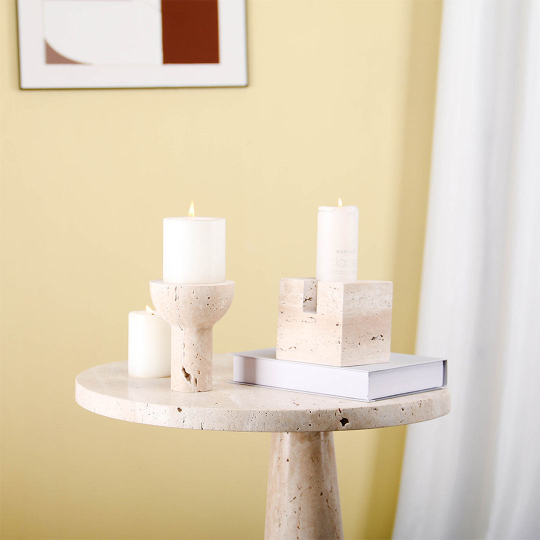 Set of BEACON candle holders with decorative figurines, designed for home decor and ambient lighting.