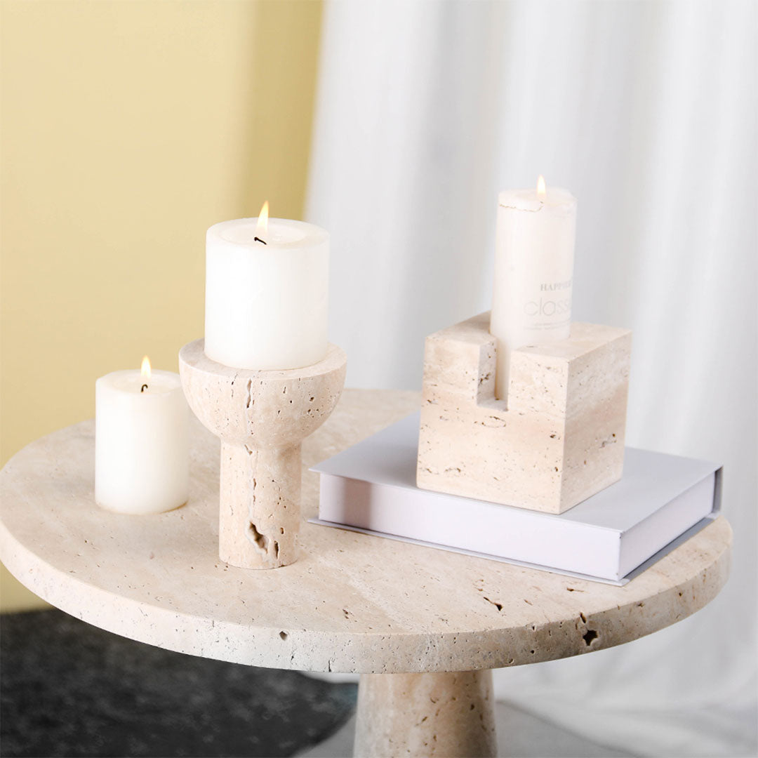 Set of two BEACON candle holders with decorative figurines, designed for home decor and ambiance.