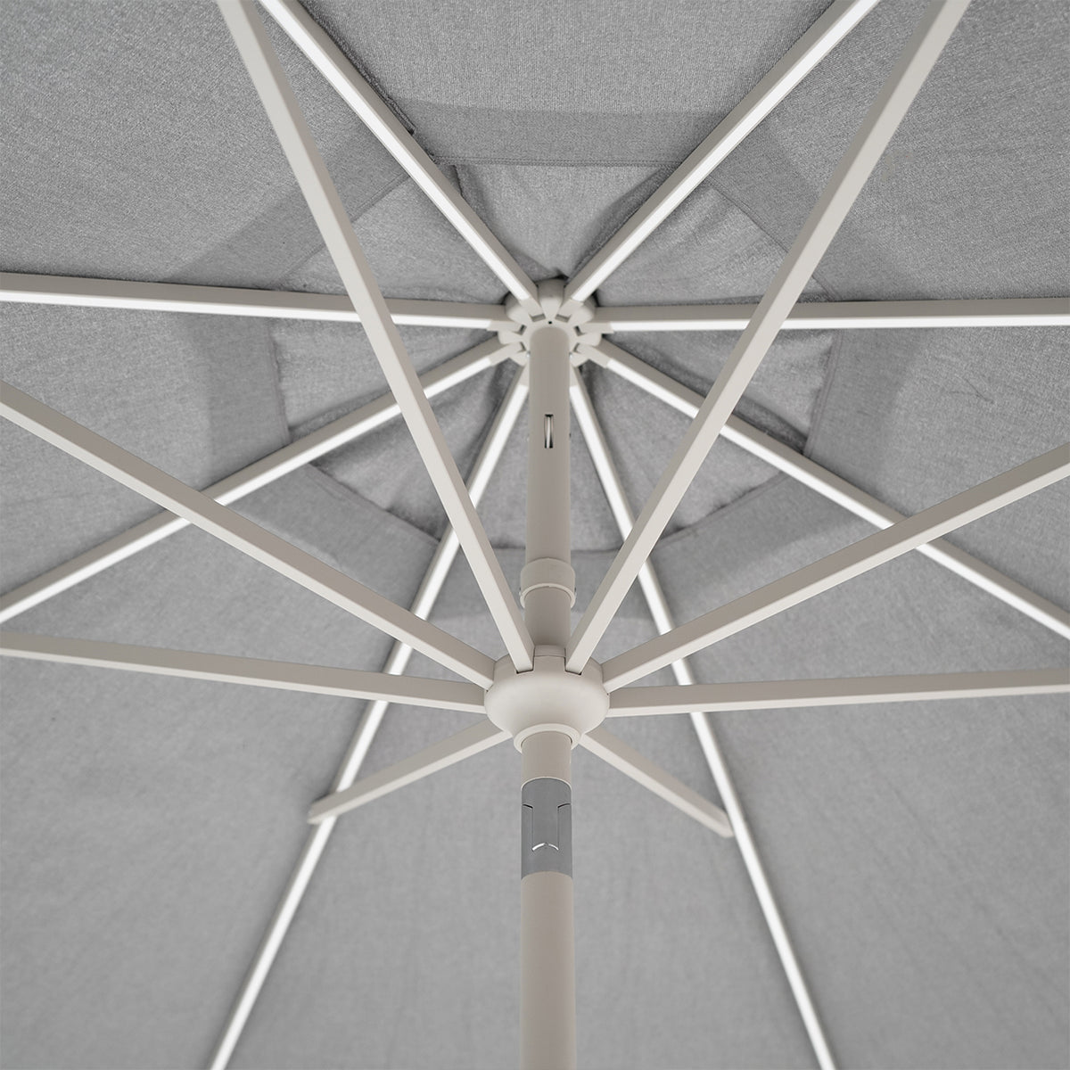 BEACON celestial center pole outdoor umbrella with crank and wheeled base, featuring a large canopy for shade.
