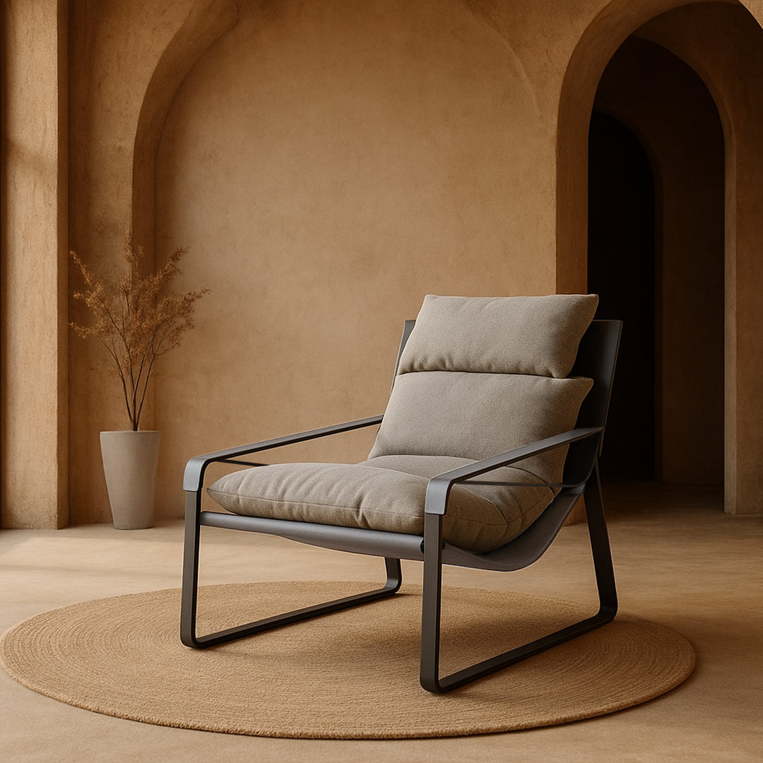 BEACON Claude Saddle Leather Lounge Chair in gray with a sleek, modern design and comfortable padded seat.