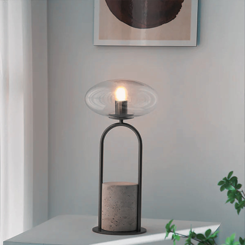 Clear glass shade table lamp by BEACON with a sleek, modern design and a transparent glass shade on a sturdy base.