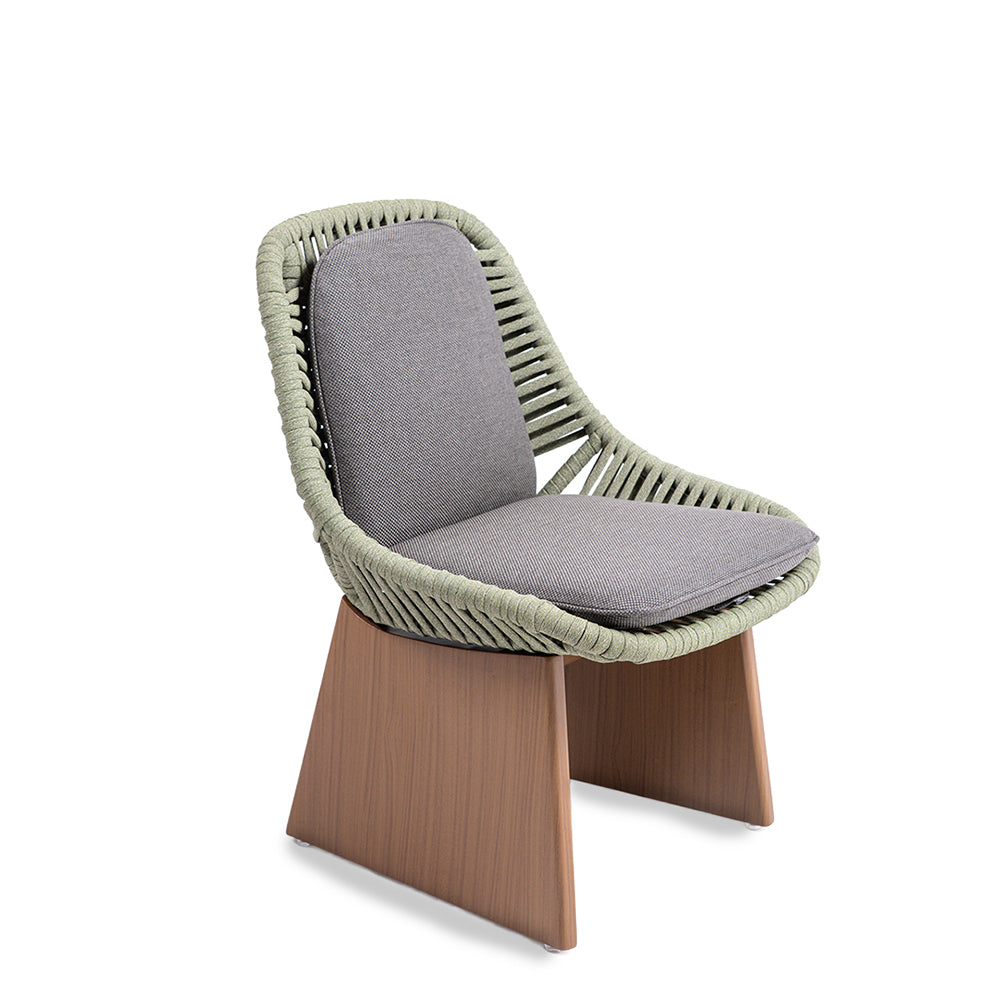 Beacon Clogs dining side chair with seat and back cushions, featuring a modern design and wooden legs.