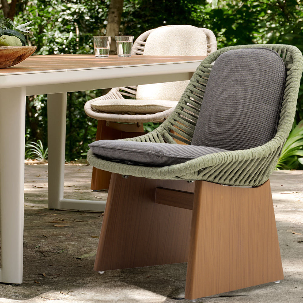 BEACON dining side chair with seat and back cushions, modern design, featuring wooden legs and upholstered cushions.