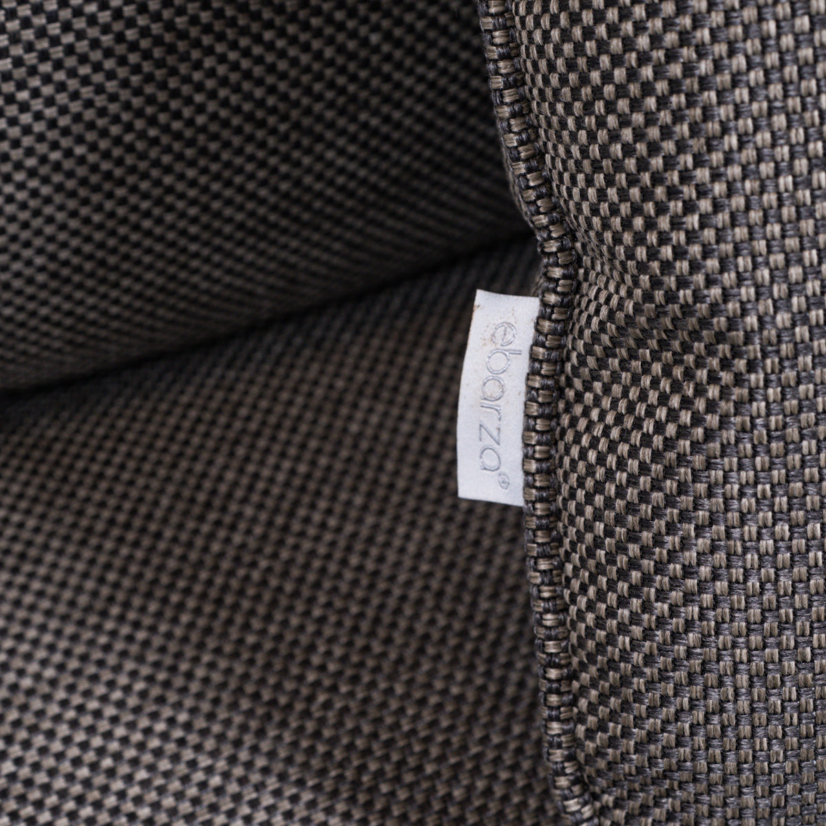 Beacon Clogs lounge chair with seat and back cushions, modern armchair with plush upholstery and stylish design.