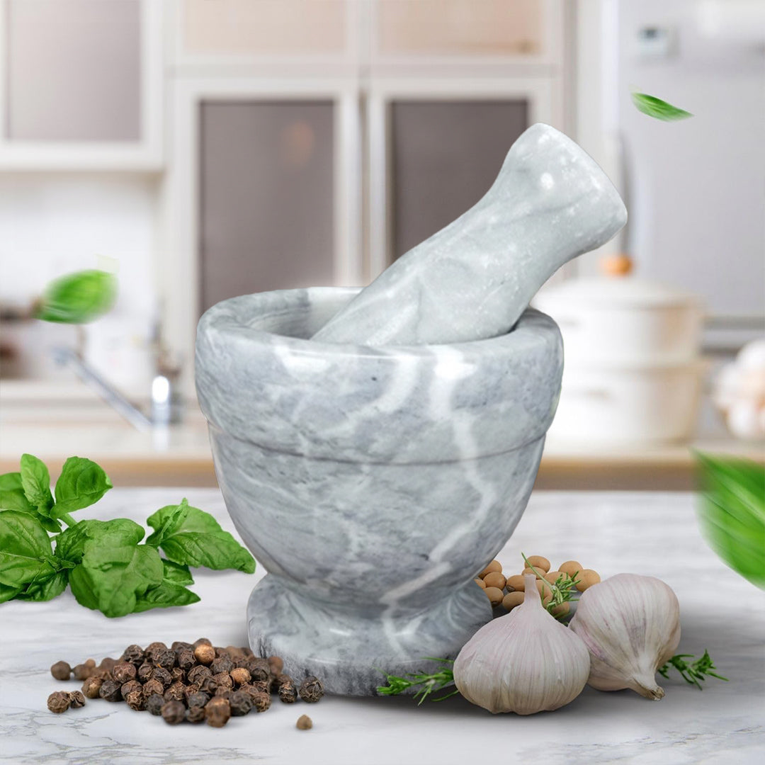 Cloudy white marble pestle and mortar from BEACON, 10.5cm diameter and height, ideal for grinding spices and herbs.