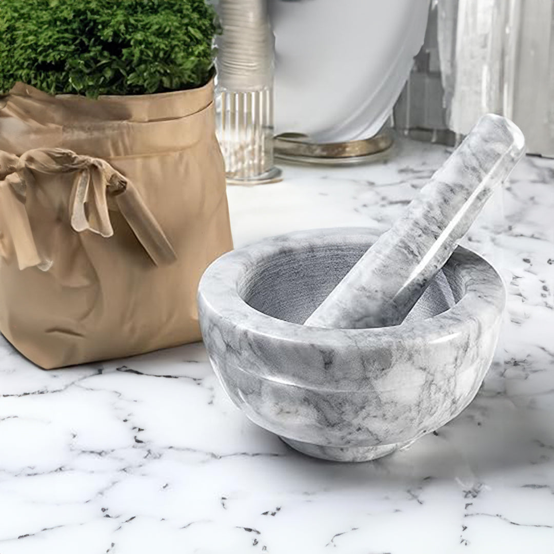 Cloudy white marble pestle and mortar set, 12cm diameter and 6cm height, designed for kitchen cookware and culinary prep.