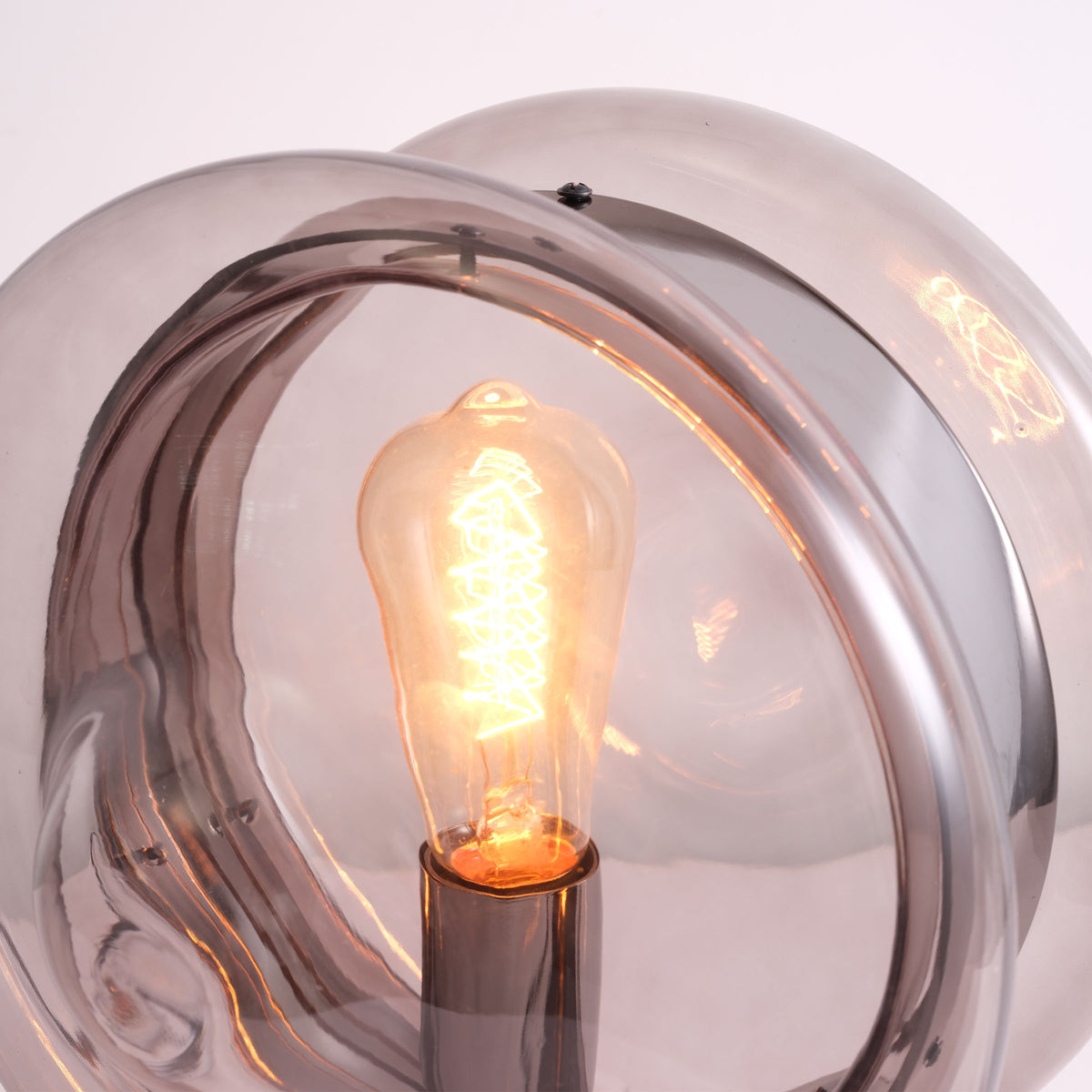 BEACON Cosmos Orb table lamp CY-TD-1049 on a desk, featuring a spherical design with modern aesthetics and soft lighting.