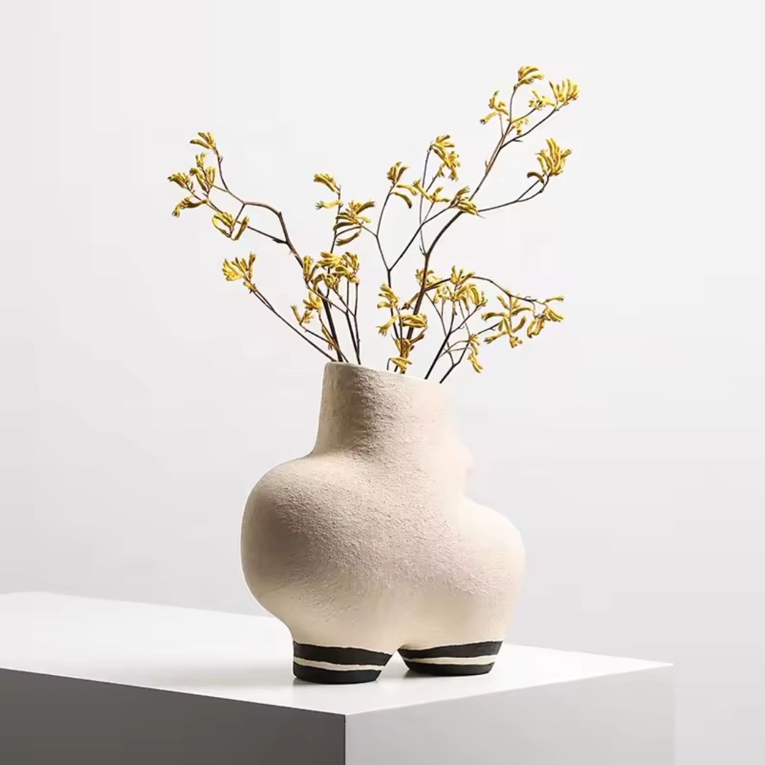 Cream ceramic vase with black stripe detail by BEACON, showcasing a sleek, modern design perfect for elegant home decor.