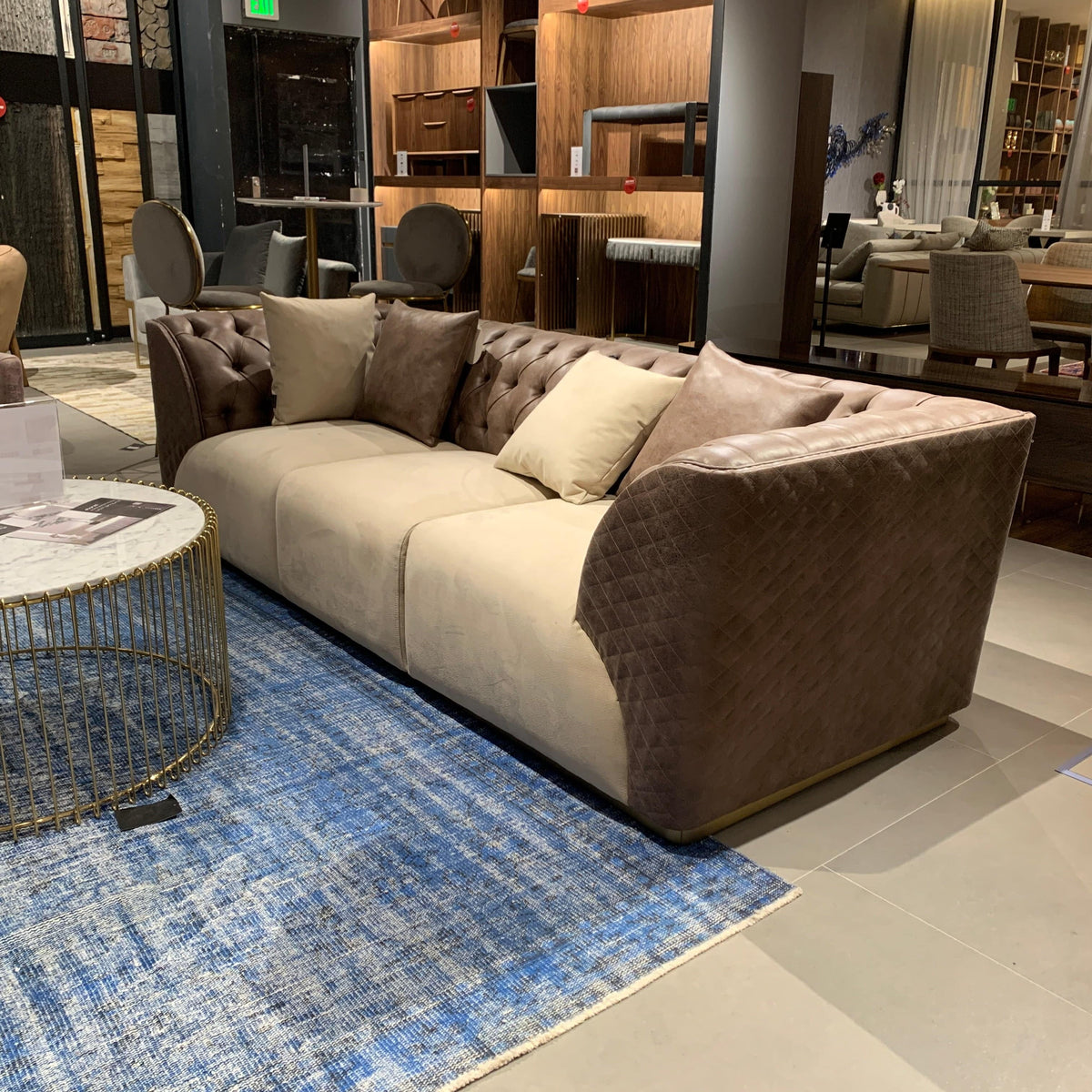 Delfina brown and beige 3-seater sofa by LODA FURNITURE with dark brown upholstery and plush cushions.