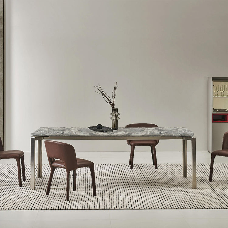 Modern dining table with natural stone top and steel legs, model DT023 by BEACON, ideal for contemporary dining spaces.