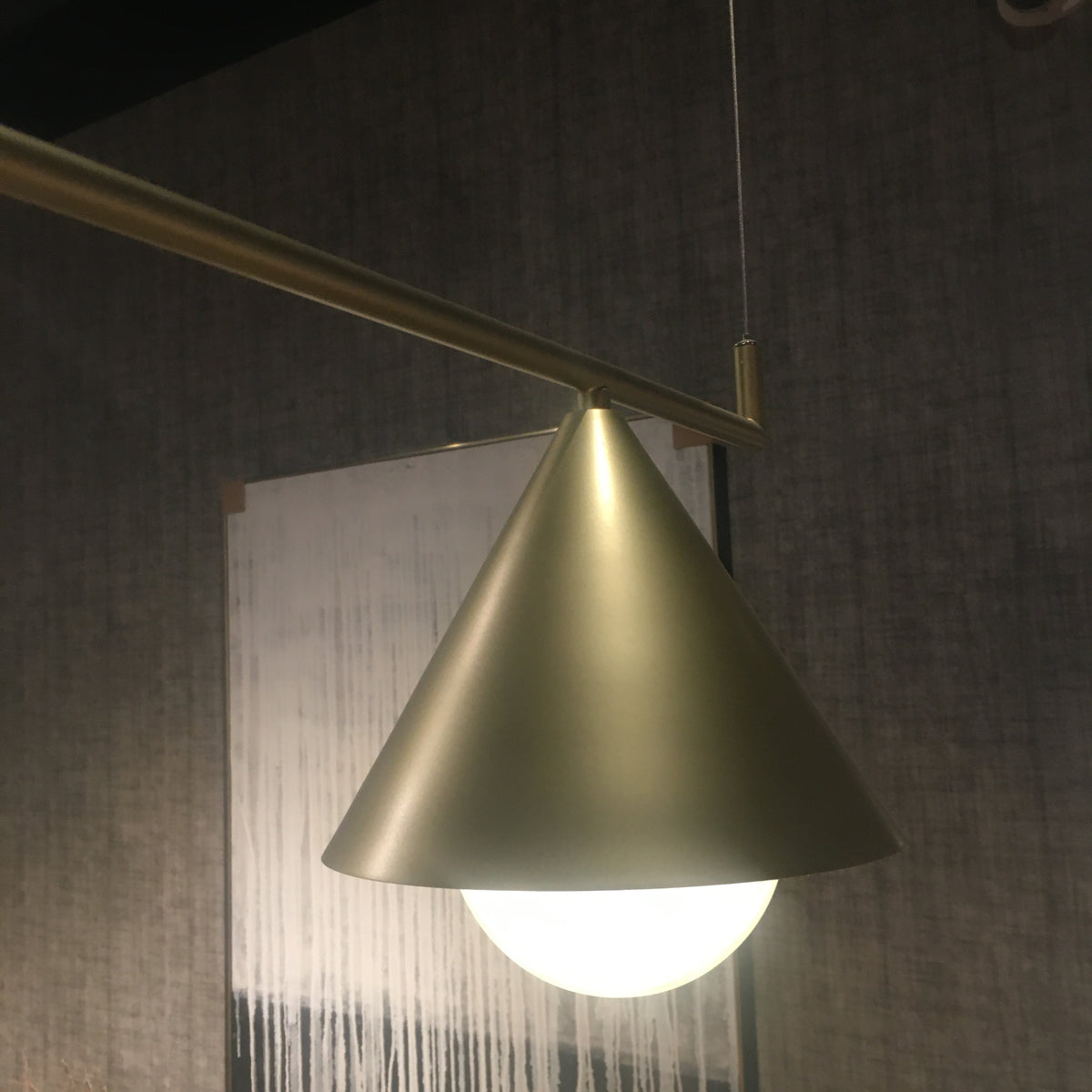 Display of the Andria 3 Heads Pendant Lamp by Beacon, showing its modern design with three hanging light fixtures.