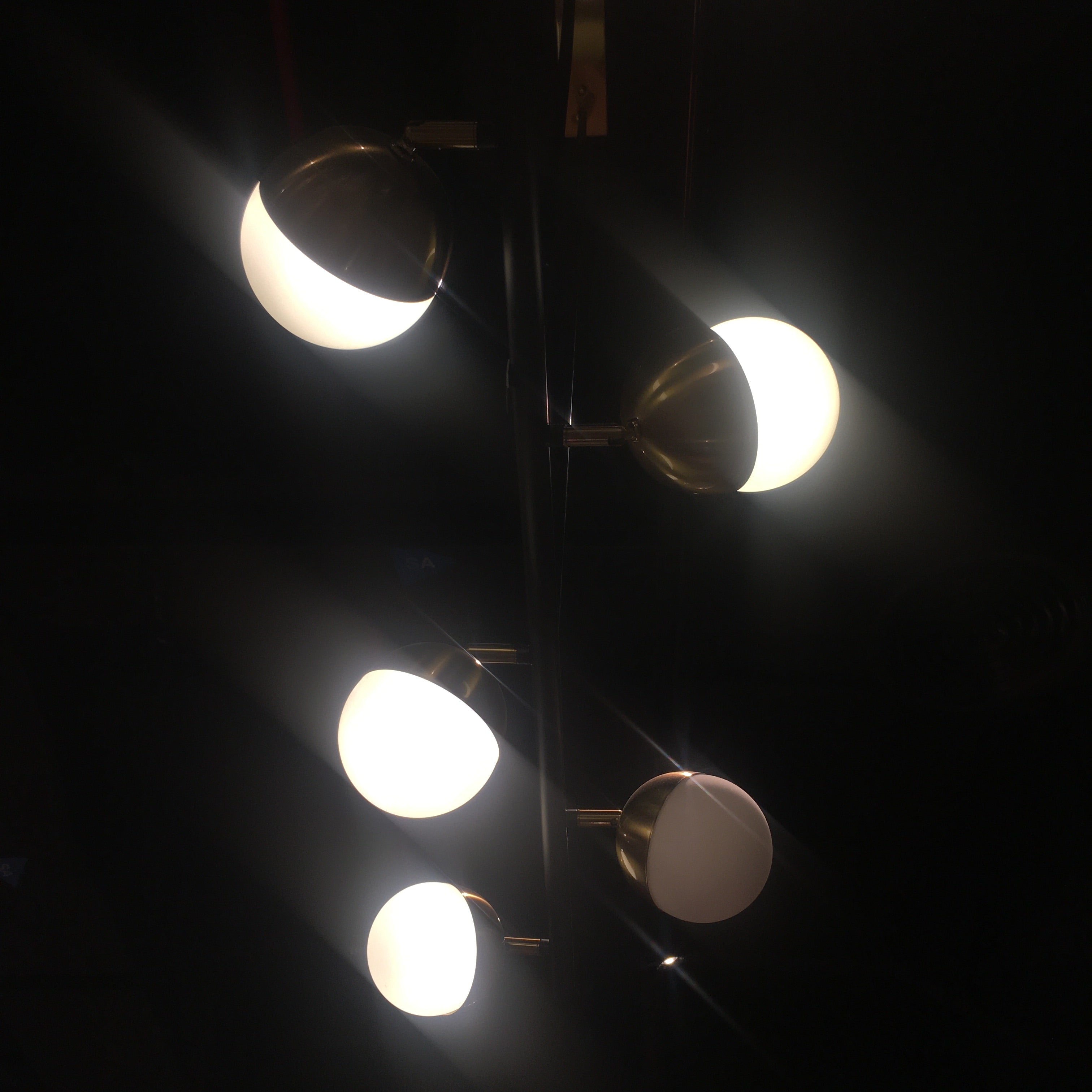 Display of Arvika 6 Heads Pendant Lamp by Beacon, featuring modern design with six hanging light fixtures and sleek black finish.