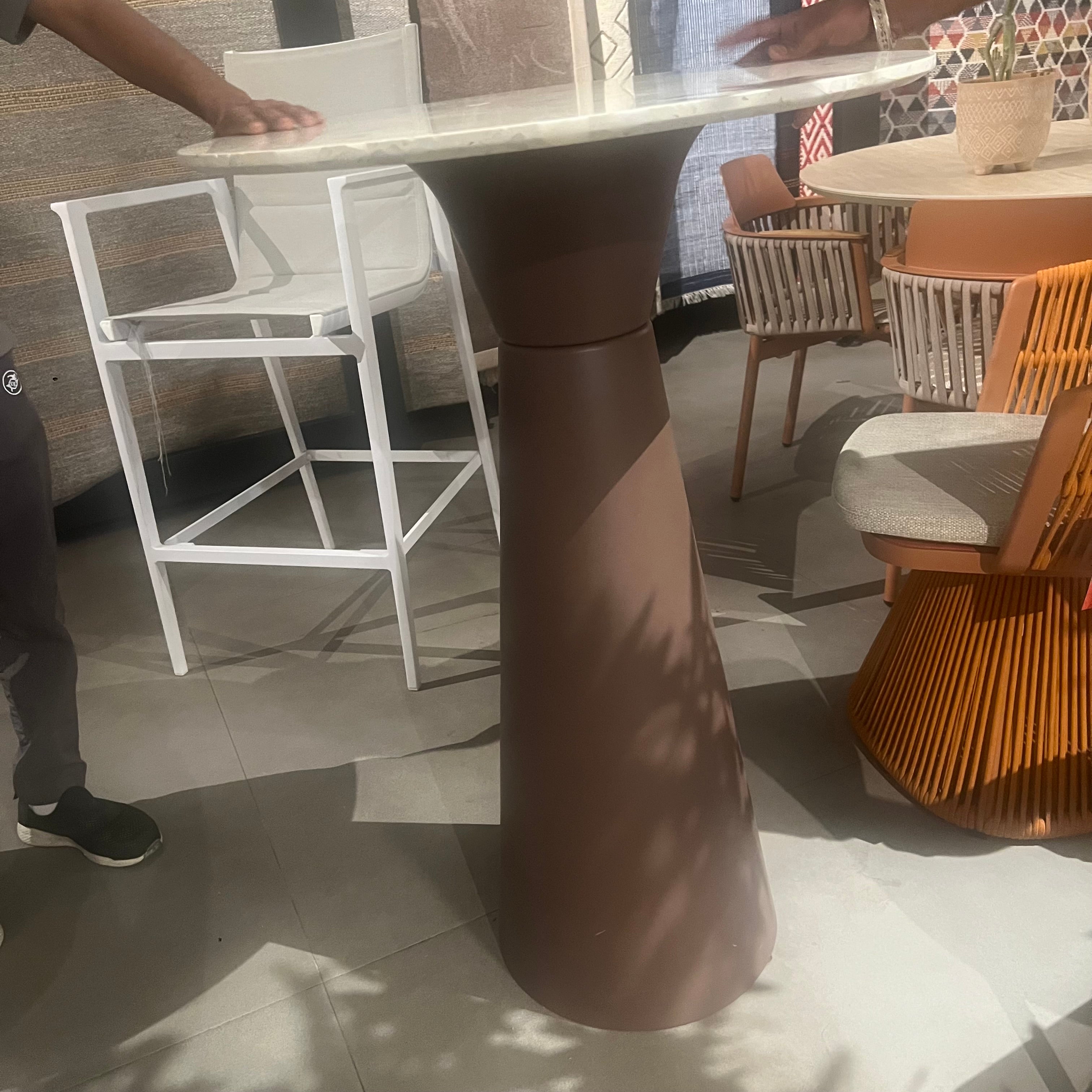 Display of a 105cm coffee bar table base by BEACON, featuring a sturdy metal construction and modern design for Nakheel spaces.