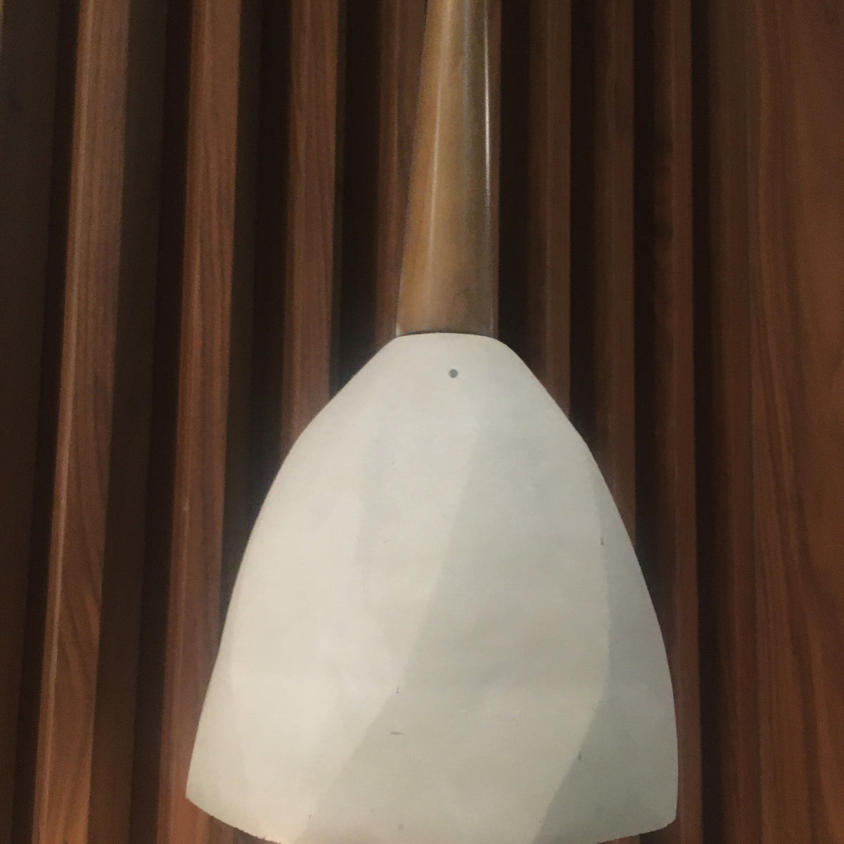 Large convex concrete and wood lamp display item by Beacon, featuring a modern design with mixed materials and sleek craftsmanship.