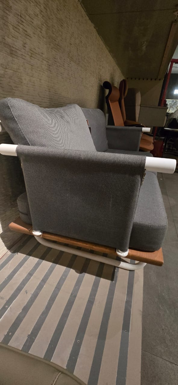 Display item of SANCREA Efsane outdoor 2-seater sofa with Nakheel design, featuring plush cushions and modern outdoor furniture style.