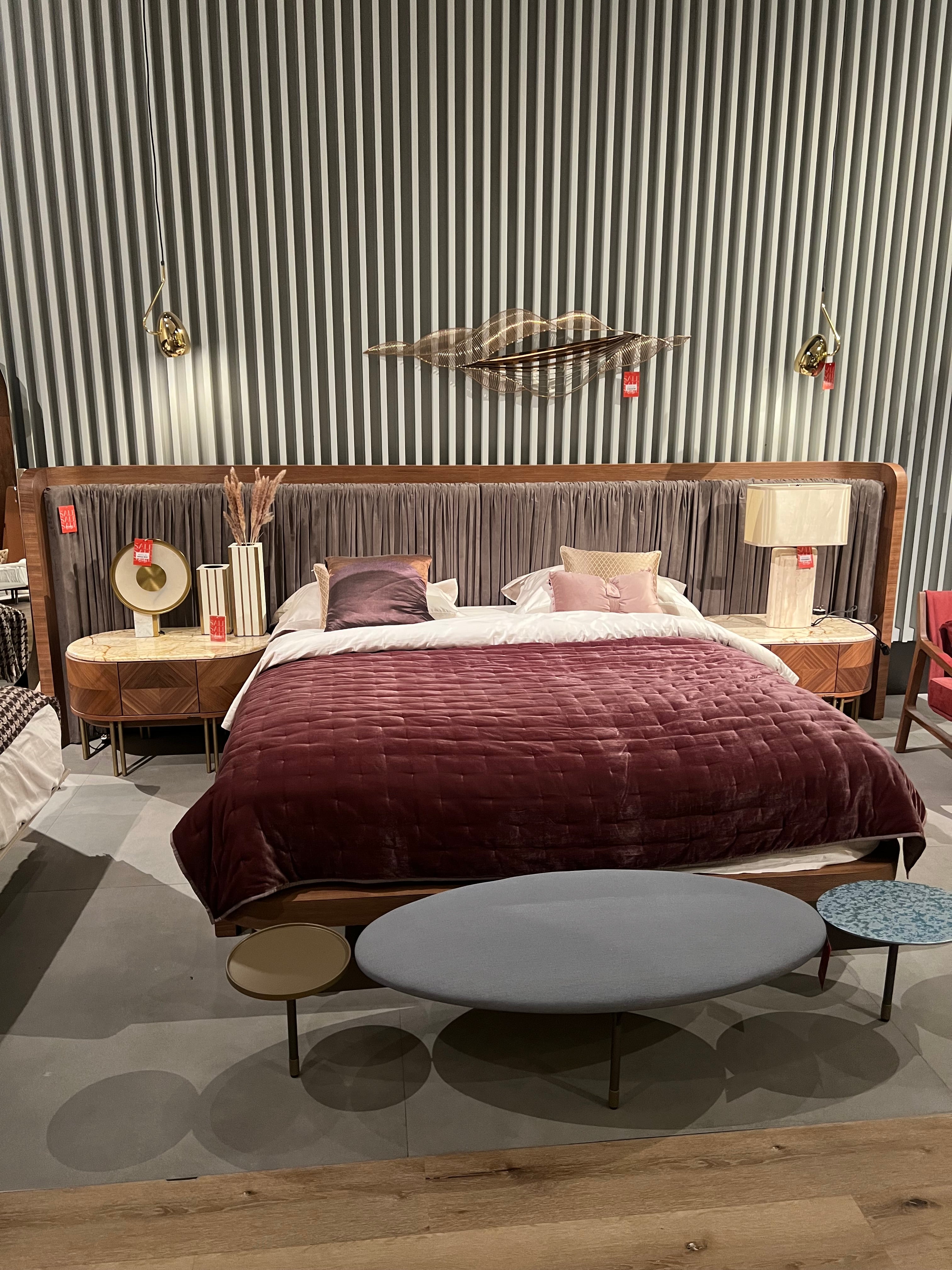 Display of Eva King Size Bedstead by LODA Furniture with a modern design and wooden frame, shown as a display model.