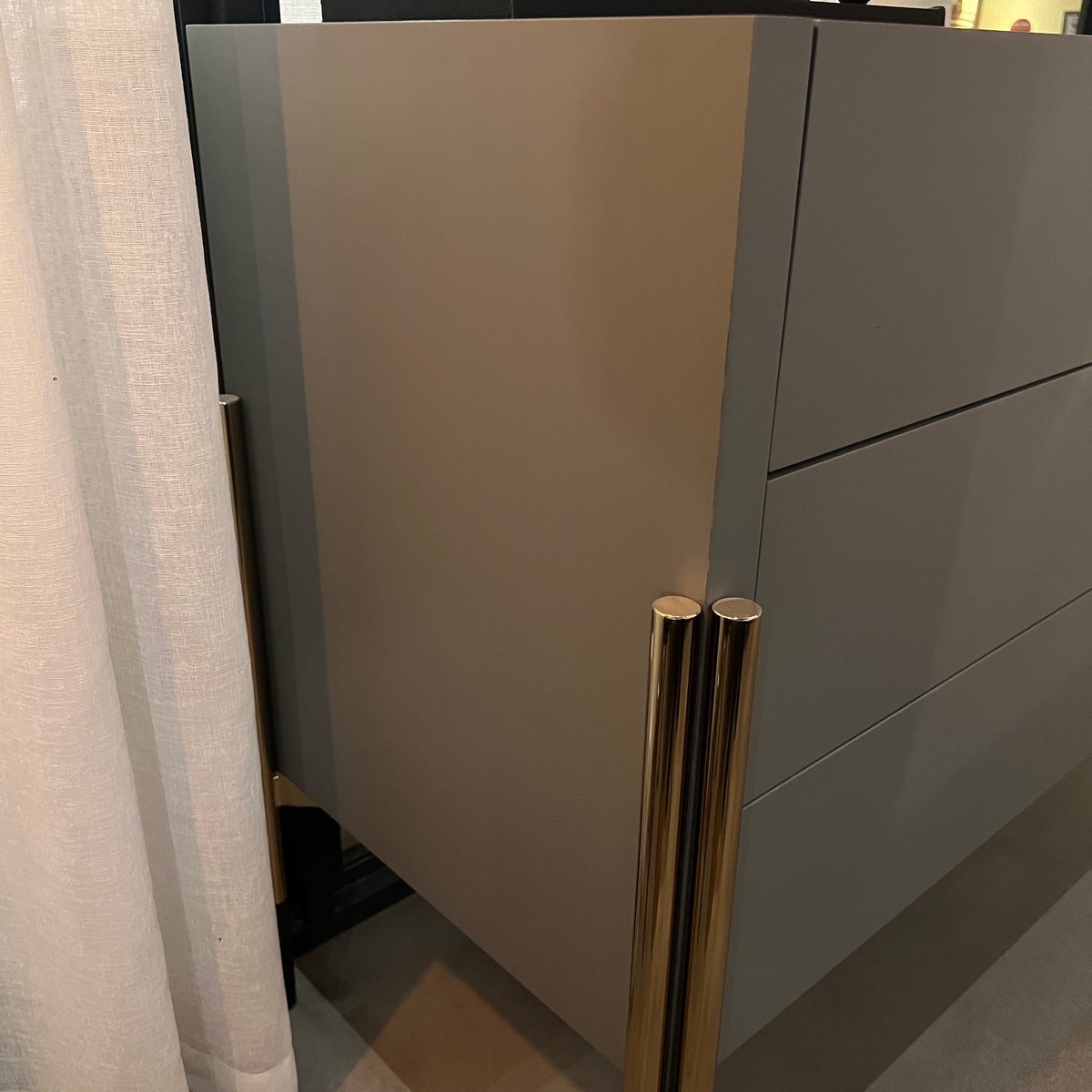 Grey dresser and mirror display item by YOL LIVING, featuring a modern dresser with a matching mirror for stylish bedroom storage.