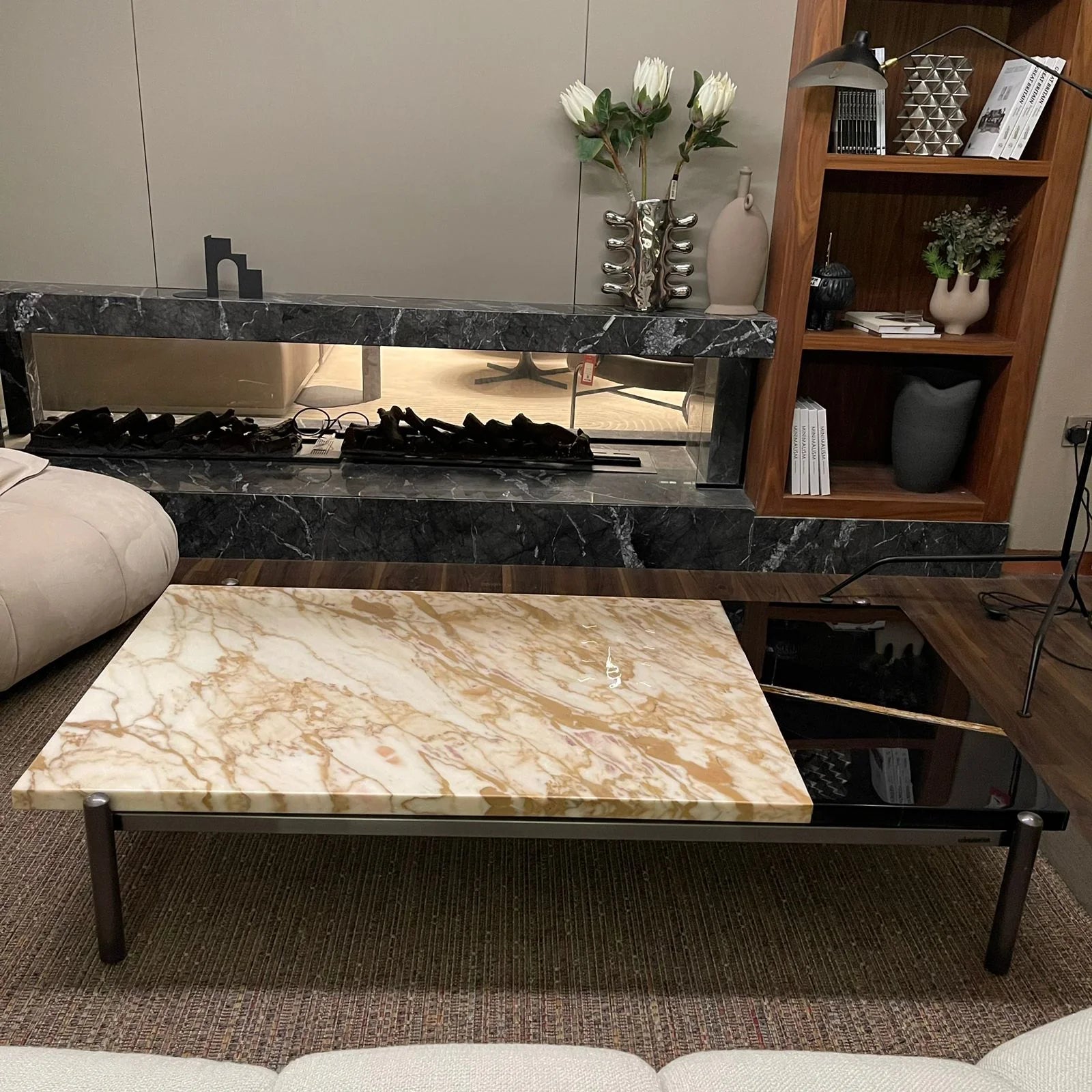 Display of the Lauren coffee table by Beacon in black and gold, showcasing its modern design and sleek finish.
