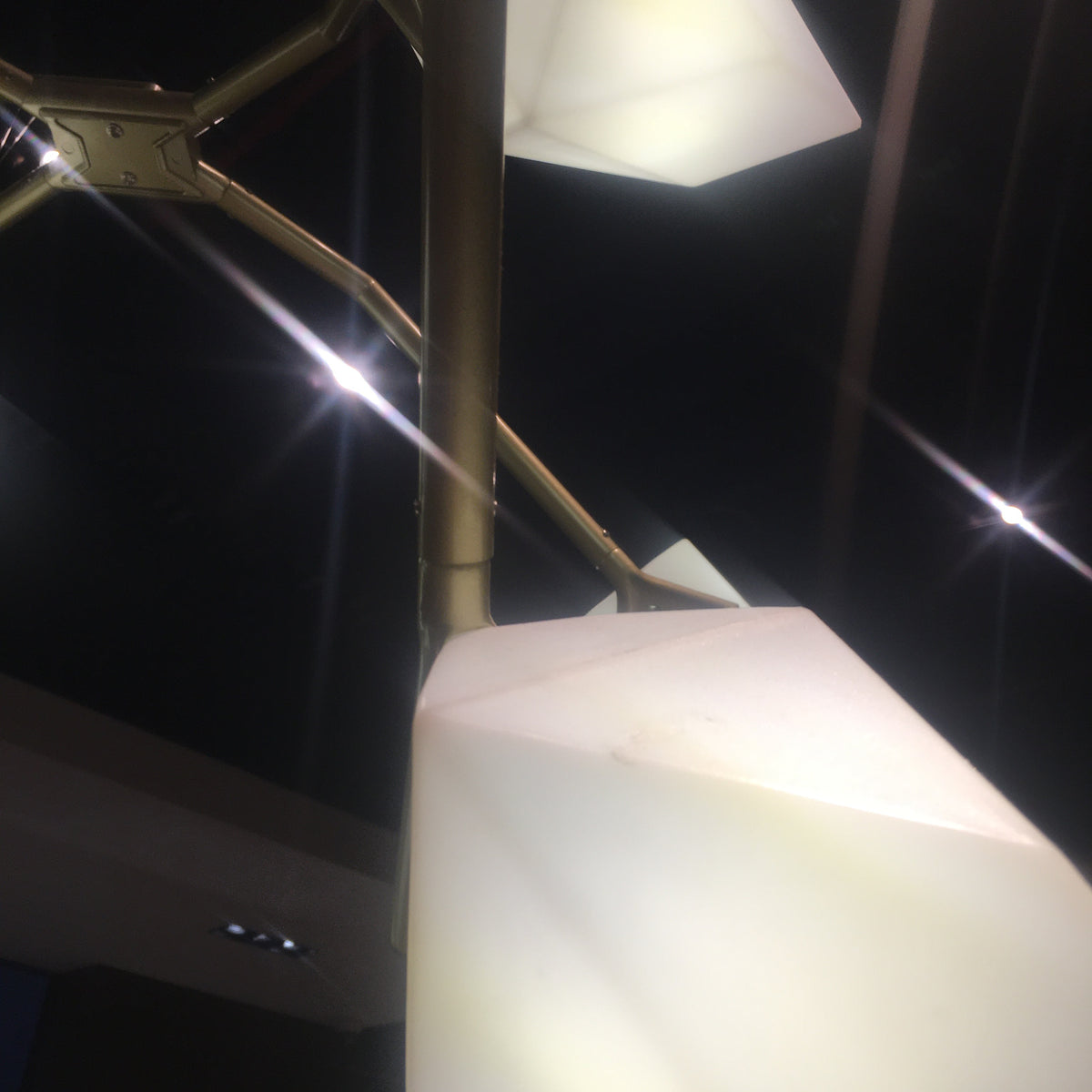 Display item of the Masko 12-heads chandelier by Beacon, featuring intricate design with multiple hanging light fixtures.