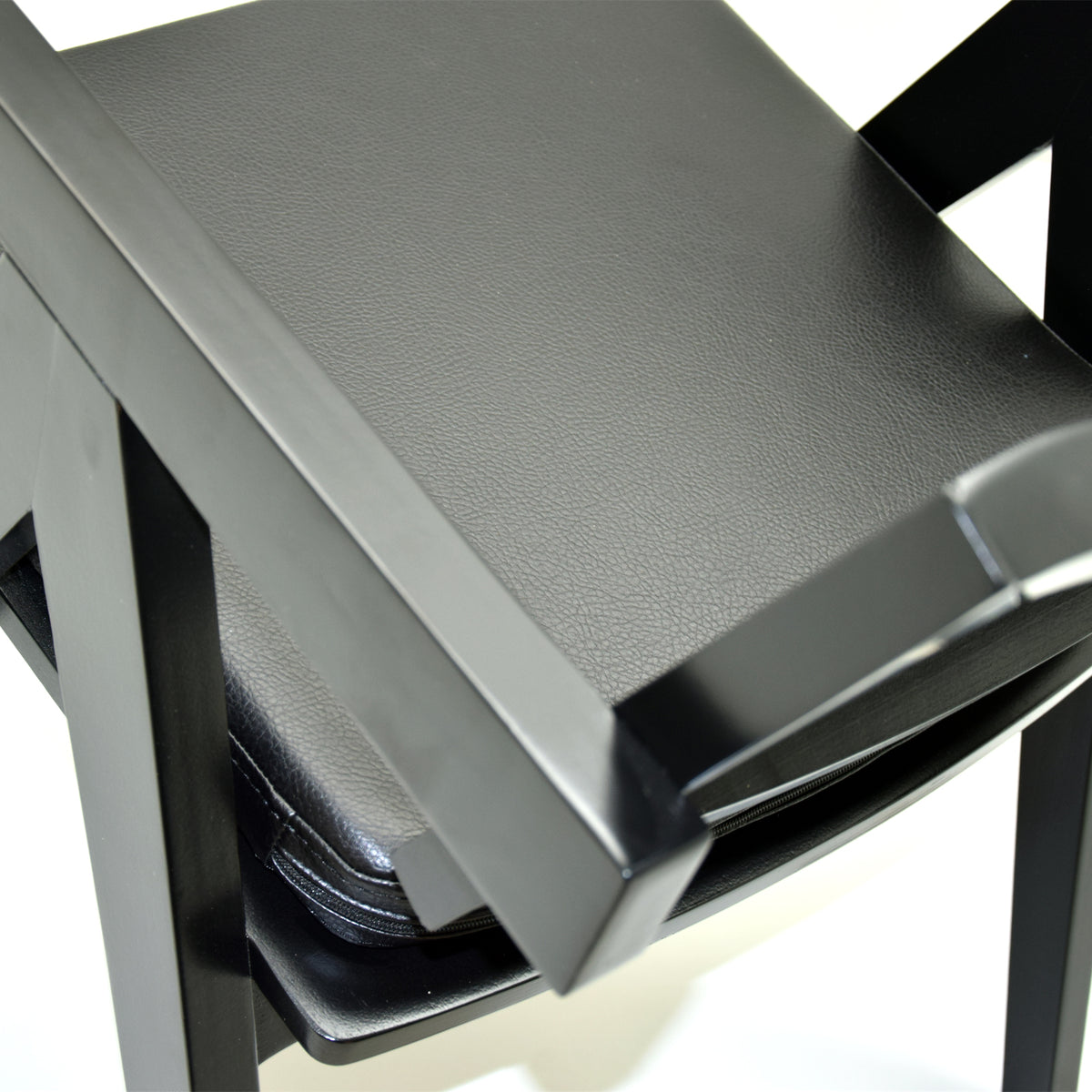 Black SANCREA Moes Armchair with corded upholstery, modern chair with plush cushioning and sleek design.