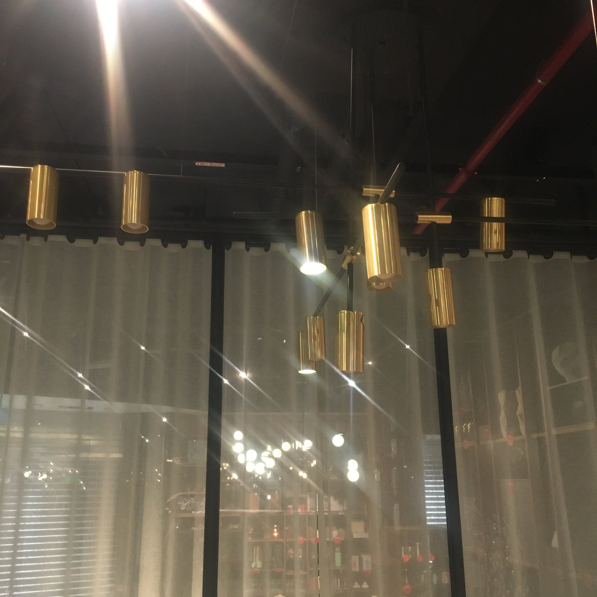 BEACON Monaco 12-heads pendant lamp with sleek design, hanging from ceiling, modern lighting fixture for stylish interior decor