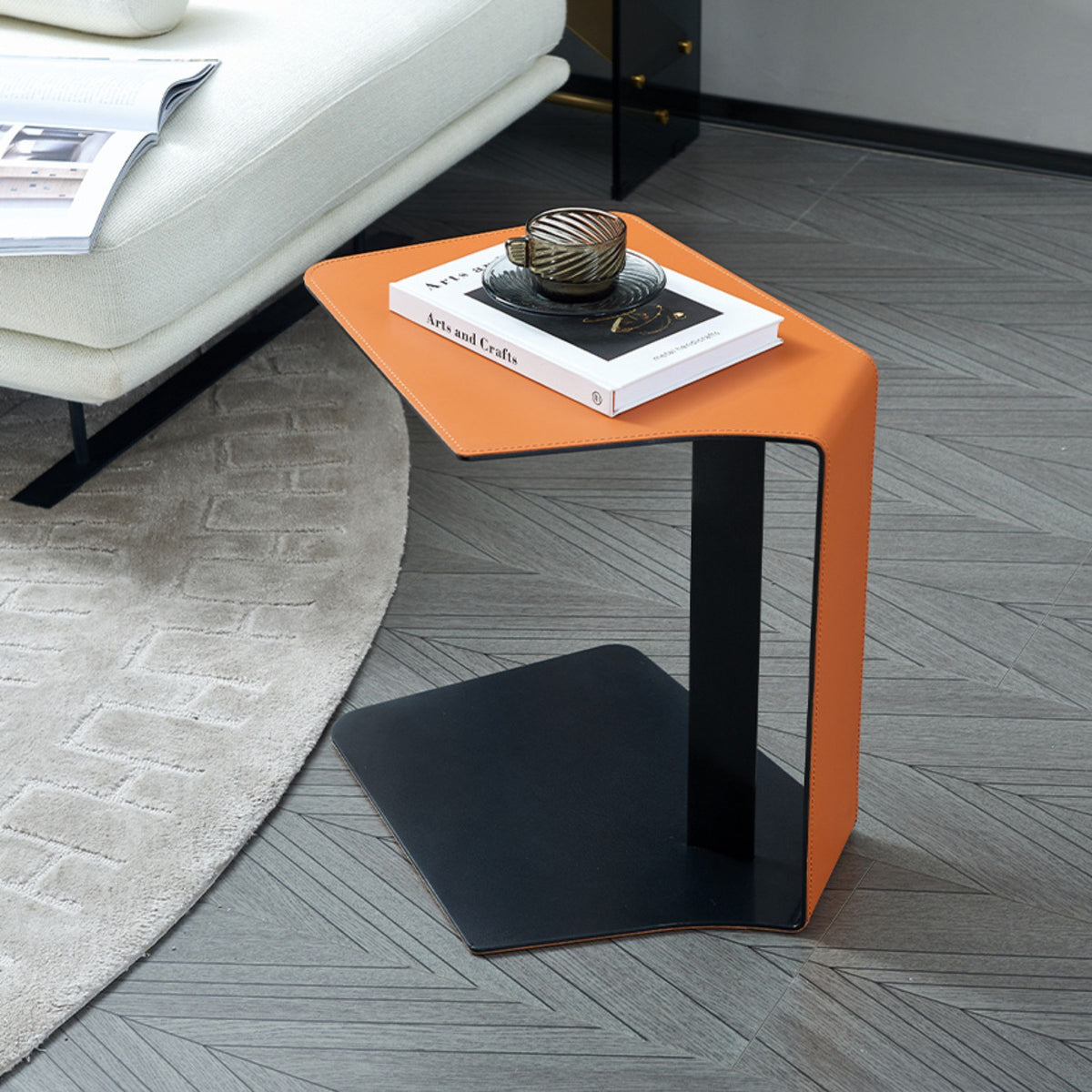 Display of the Mycroft Saddle Leather Side Table by BEACON, featuring a sleek saddle leather surface and modern design.