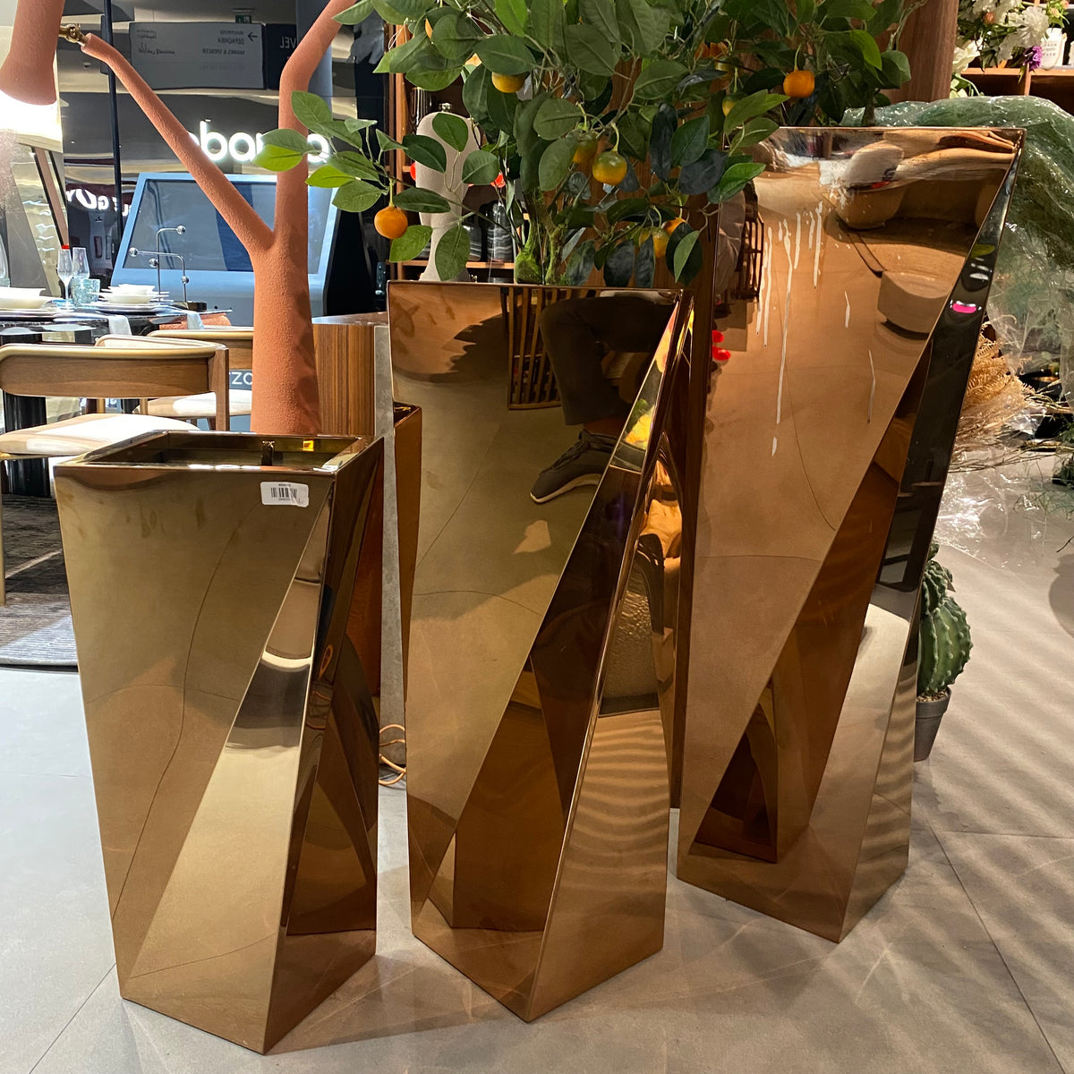 Set of 3 large stainless steel planter boxes by Beacon, featuring sleek modern design for indoor or outdoor decoration.