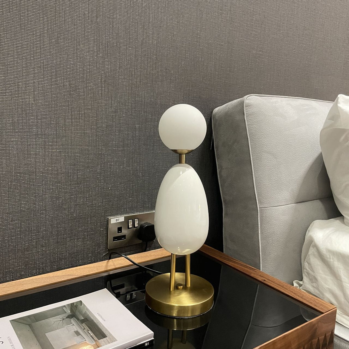 White BEACON desk table lamp CY-LTD-1011-W with modern design, shown on a display table for a stylish workspace or room decor.