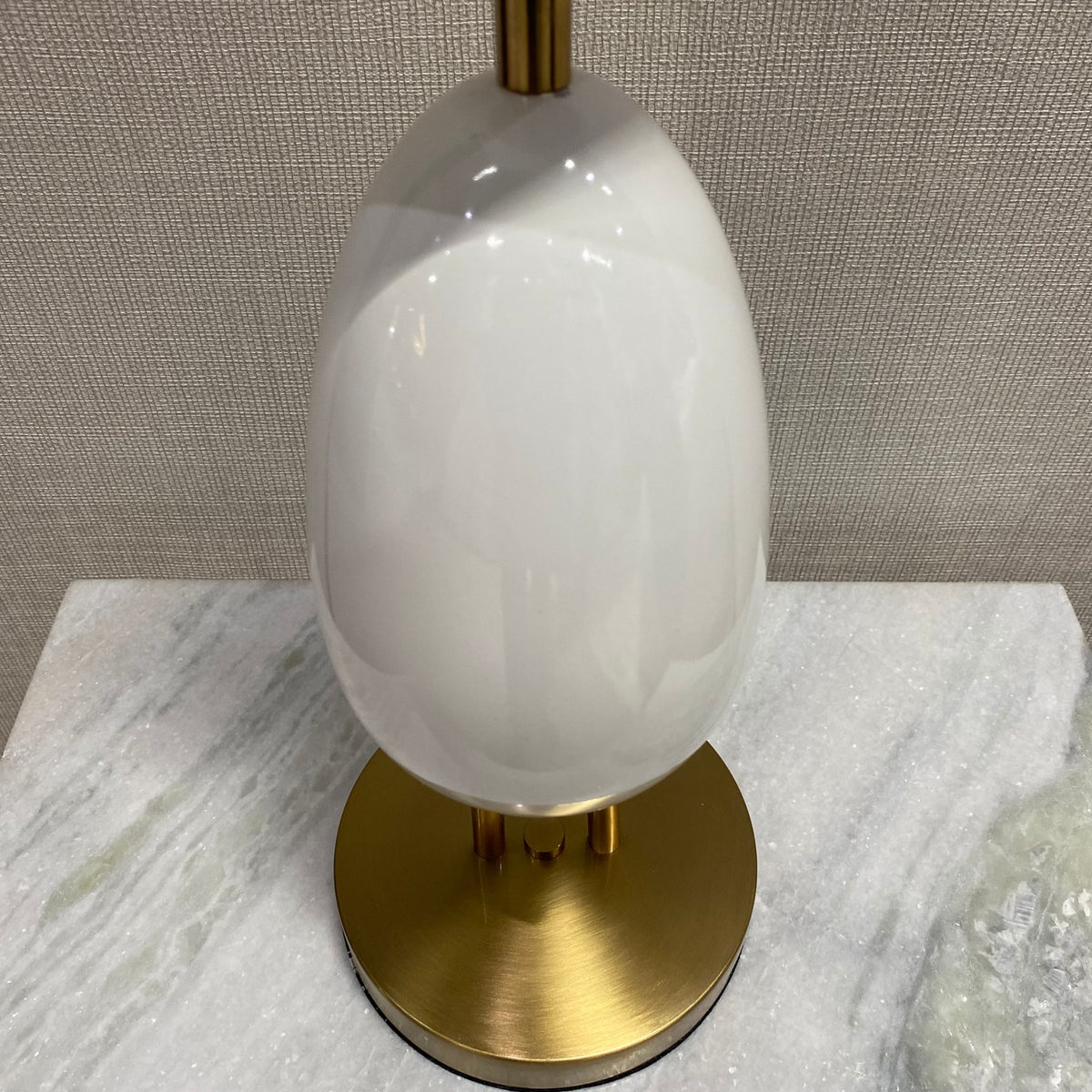 White BEACON desk table lamp CY-LTD-1011-W with a modern design, shown on a display table for stylish home or office lighting.