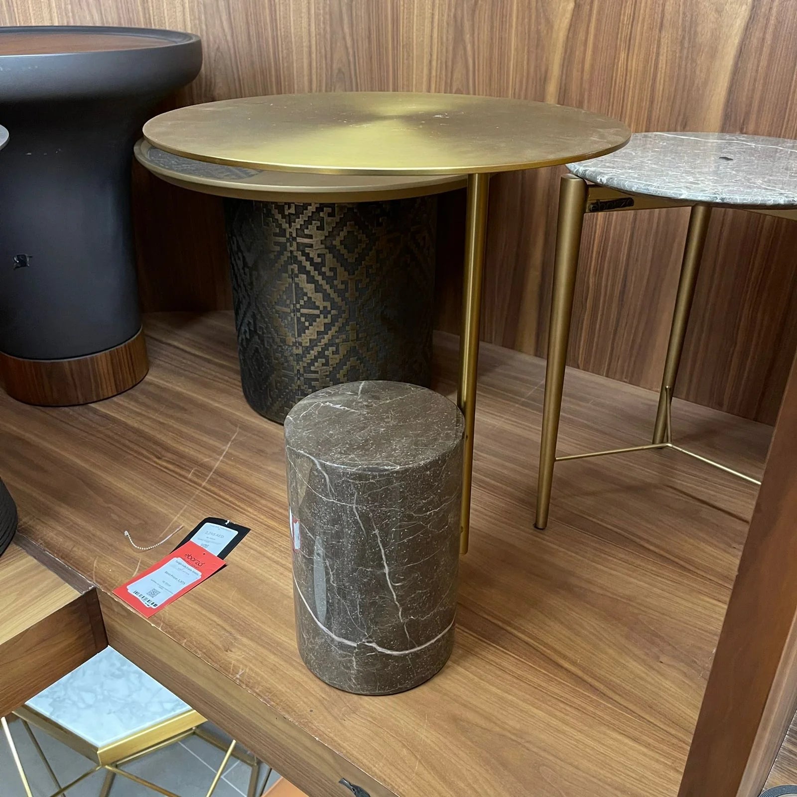 Display image of the Tango Side Table by Beacon, featuring a sleek design with a dark finish, perfect for modern living spaces.