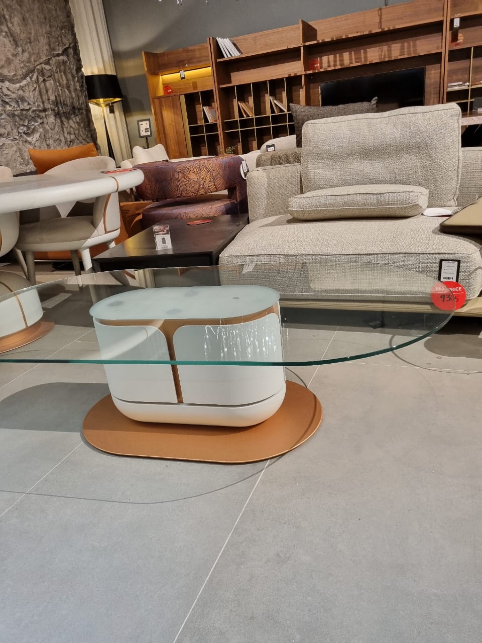 Loda Furniture Tulip coffee table display item with sleek round white top and curved metal legs, modern design.