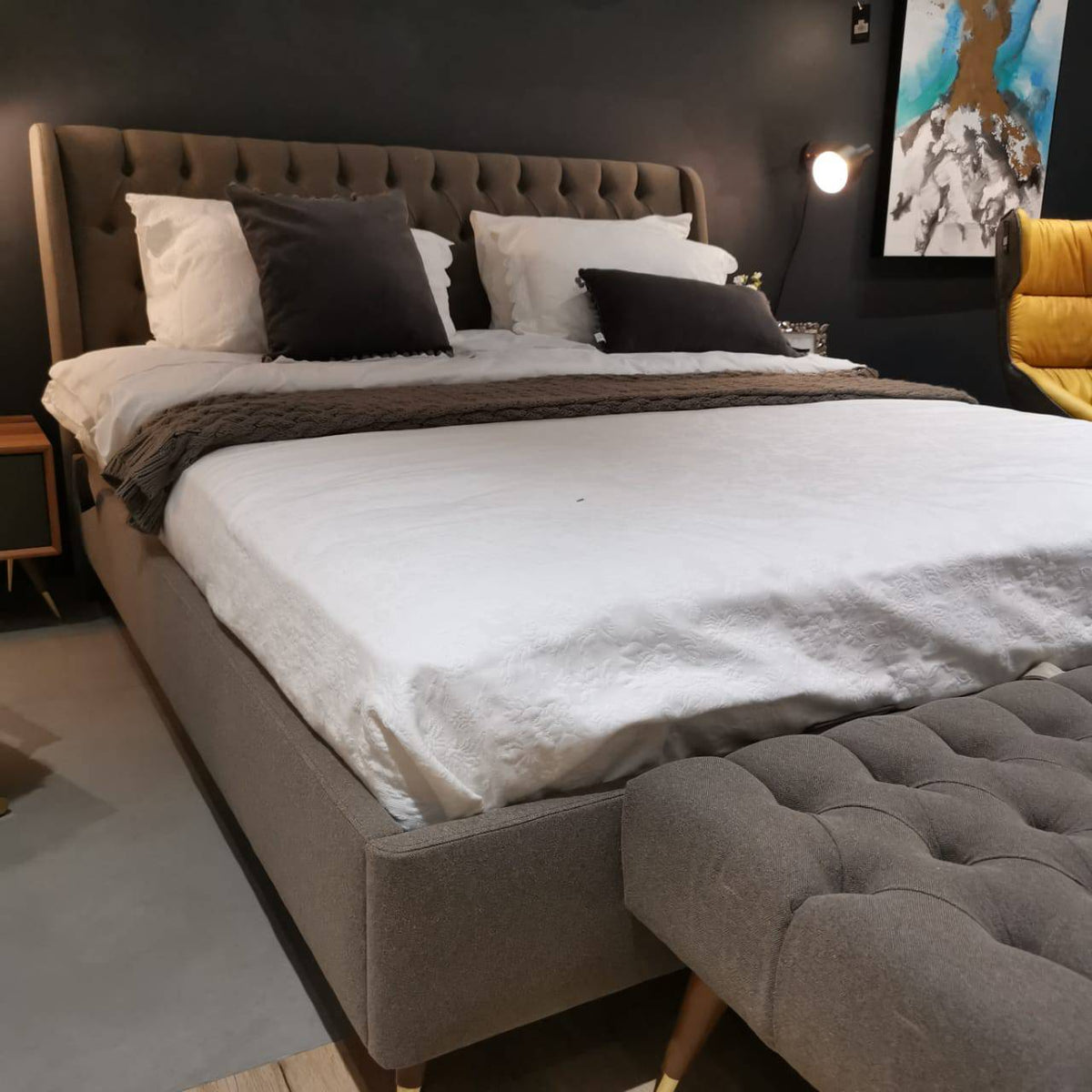 Display piece of Alvin full bed set by Nills Furniture Design, showcasing a modern bedroom display with bed frame and bedding.