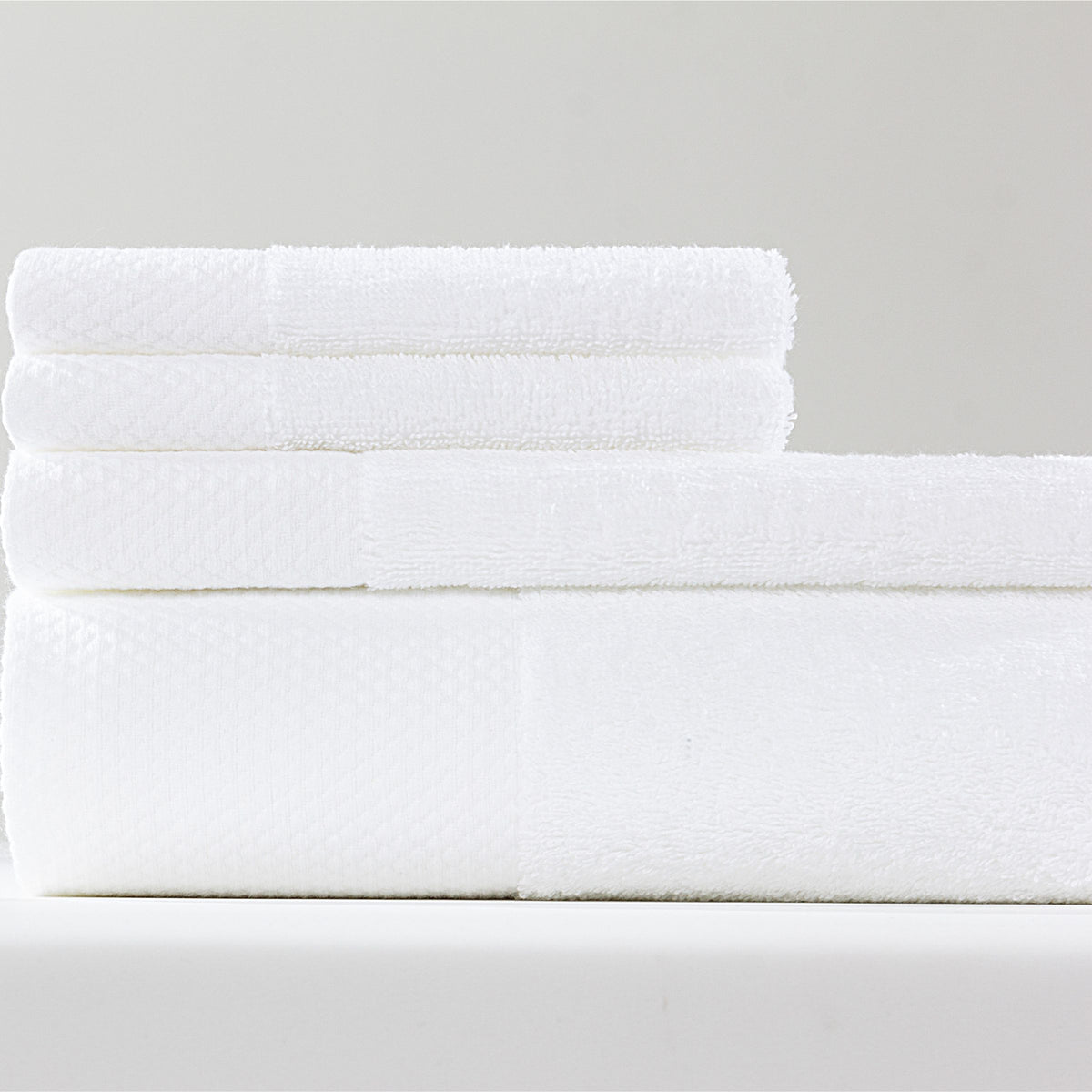 Set of ebarza Dobby Border Towels by BEACON, featuring elegant border design, soft fabric, and absorbent material.