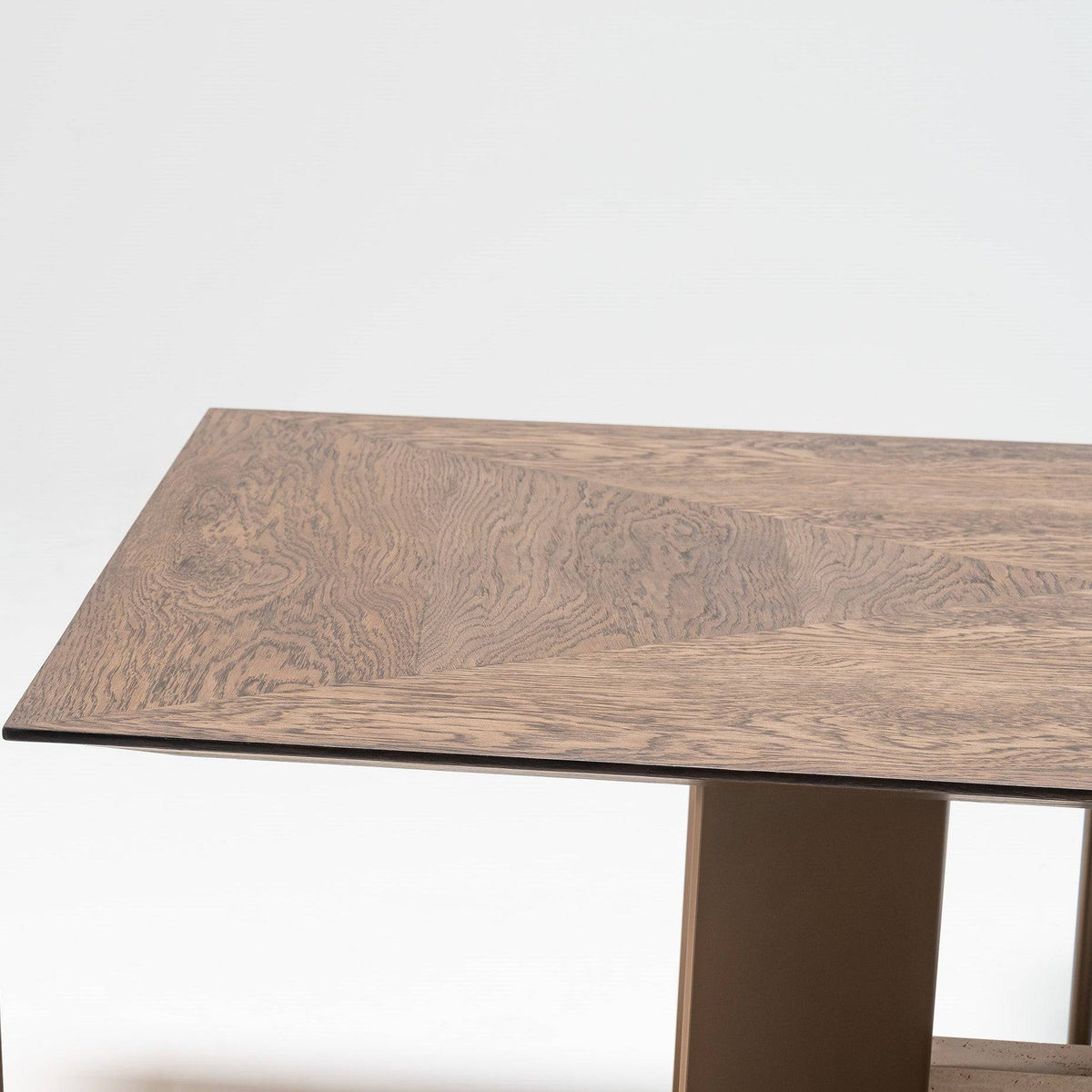 Edessa Dining Table by HOMAGE KOLTUK with marble legs, featuring a sleek wooden tabletop for modern dining spaces.