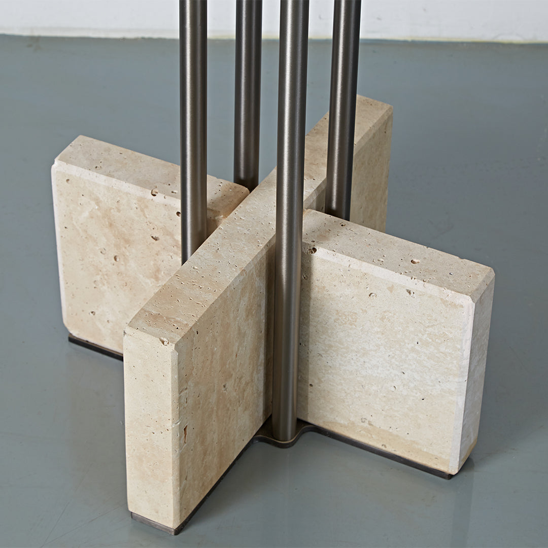 Elysian Travertine Bar Table by BEACON, with a sleek travertine top and sturdy metal base, ideal for modern bar areas.
