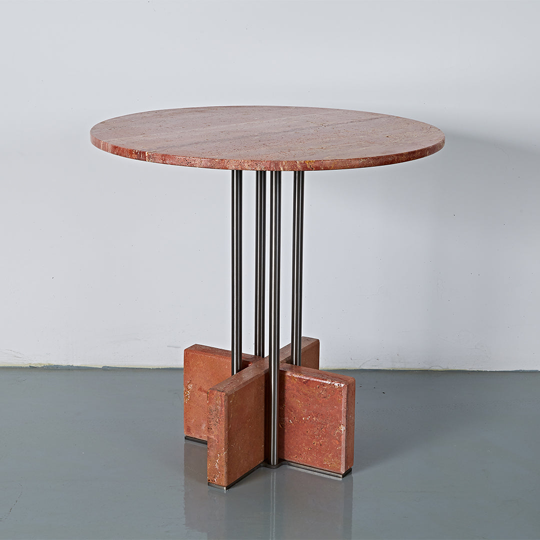 Elysian Travertine Dining Table by BEACON with a sleek, modern design featuring a travertine tabletop and sturdy wooden legs.