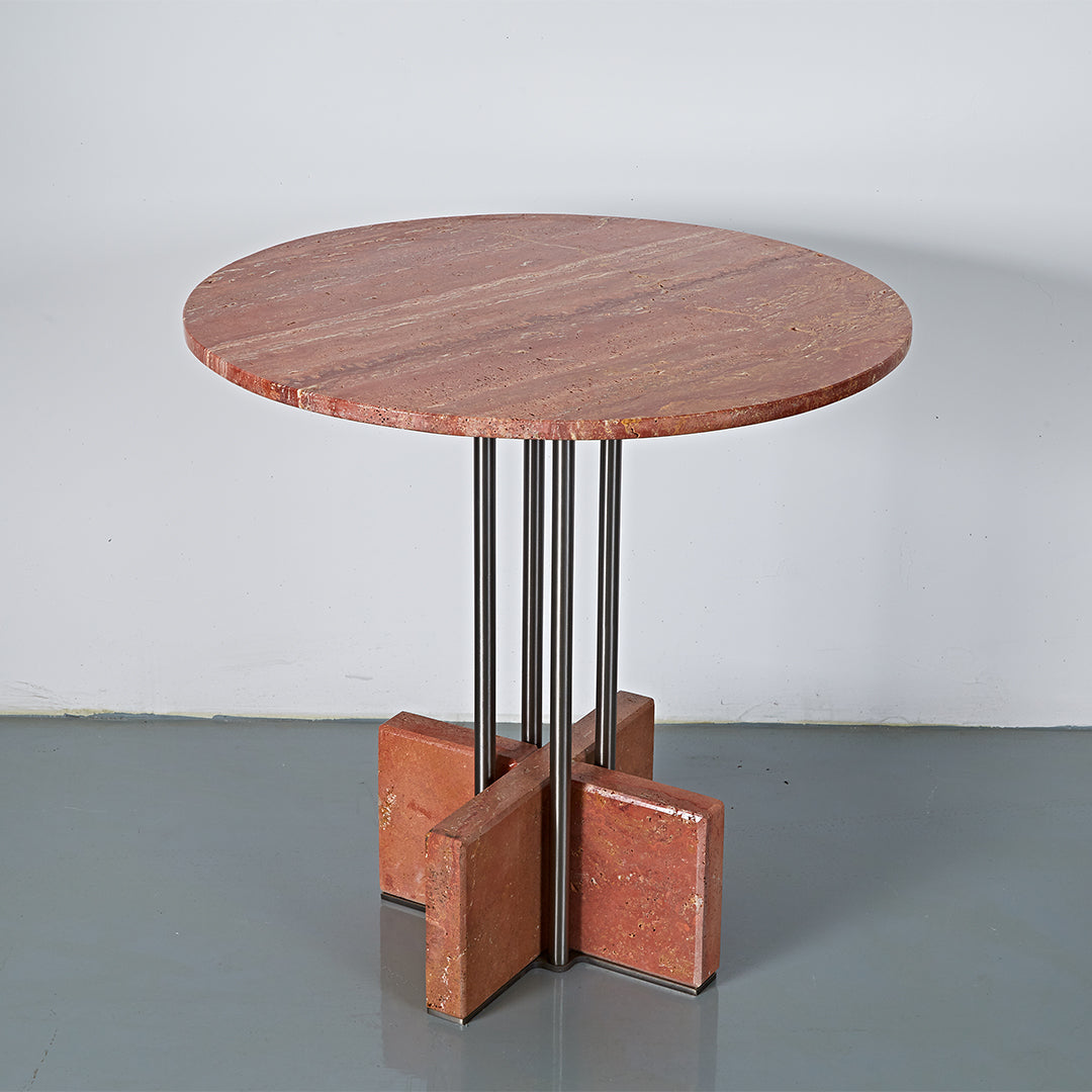 Elysian Travertine Dining Table by BEACON featuring a sleek, modern design with a travertine surface and sturdy wooden legs.