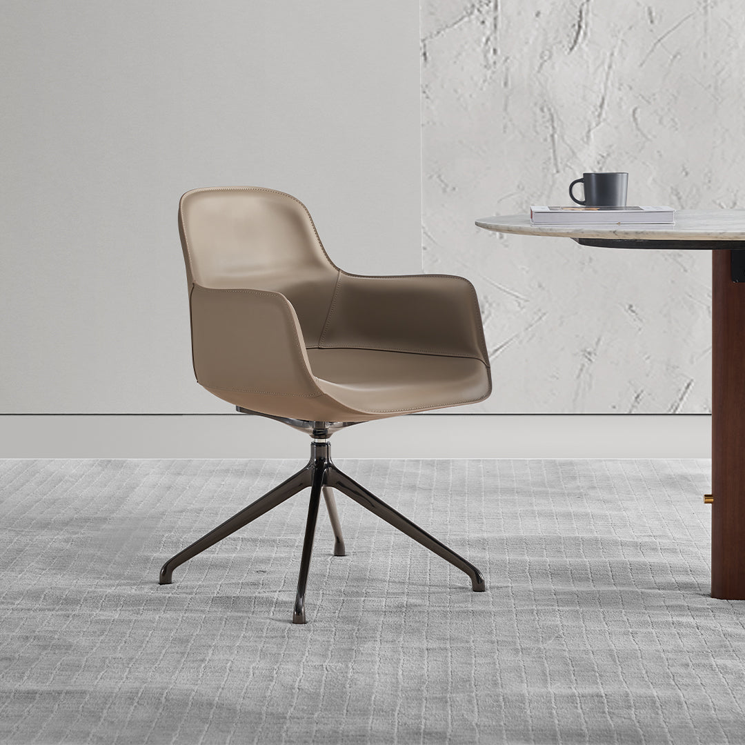 Equus Contour beige saddle leather dining chair by BEACON, with a sleek modern design and comfortable seating.
