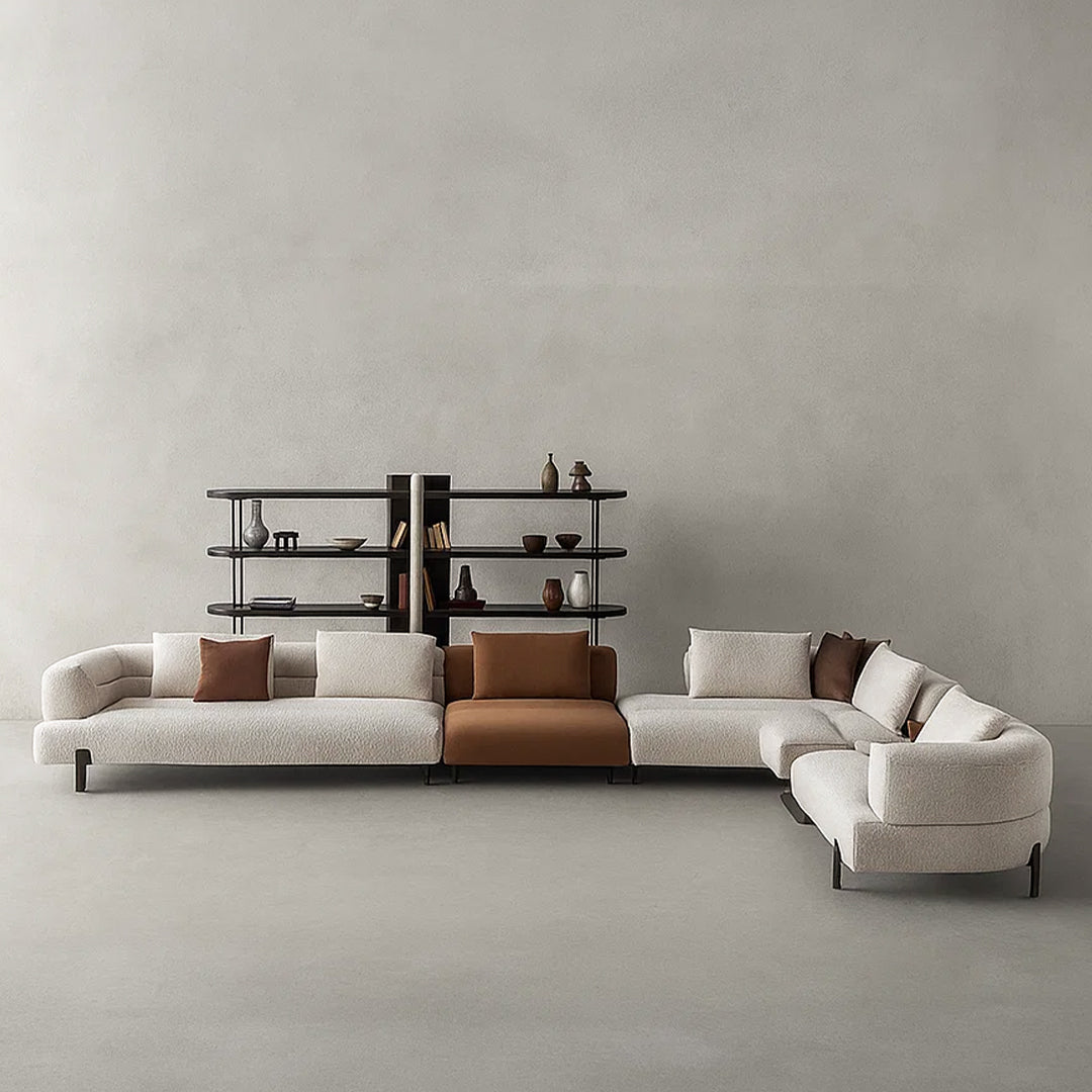 Display image of the Freda Corner Sofa by Homage Koltuk, featuring a modern L-shaped gray fabric sofa with plush cushions.