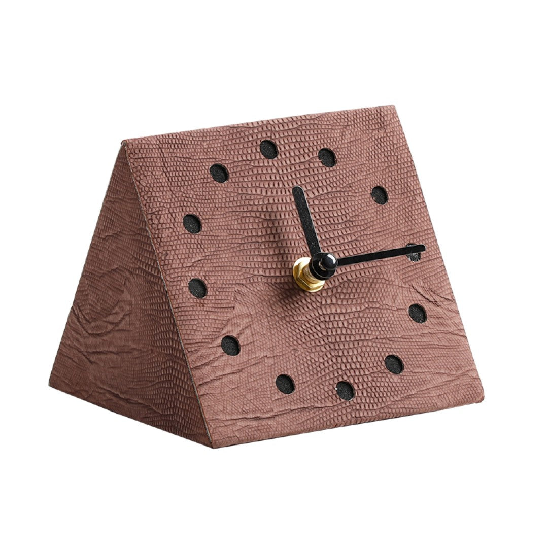 Brown geometric clock by BEACON, featuring a modern design with angular shapes and a stylish finish.