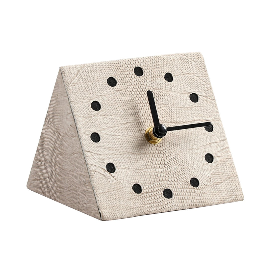 Gray geometric clock by BEACON with a modern, angular design, perfect for contemporary home decor.