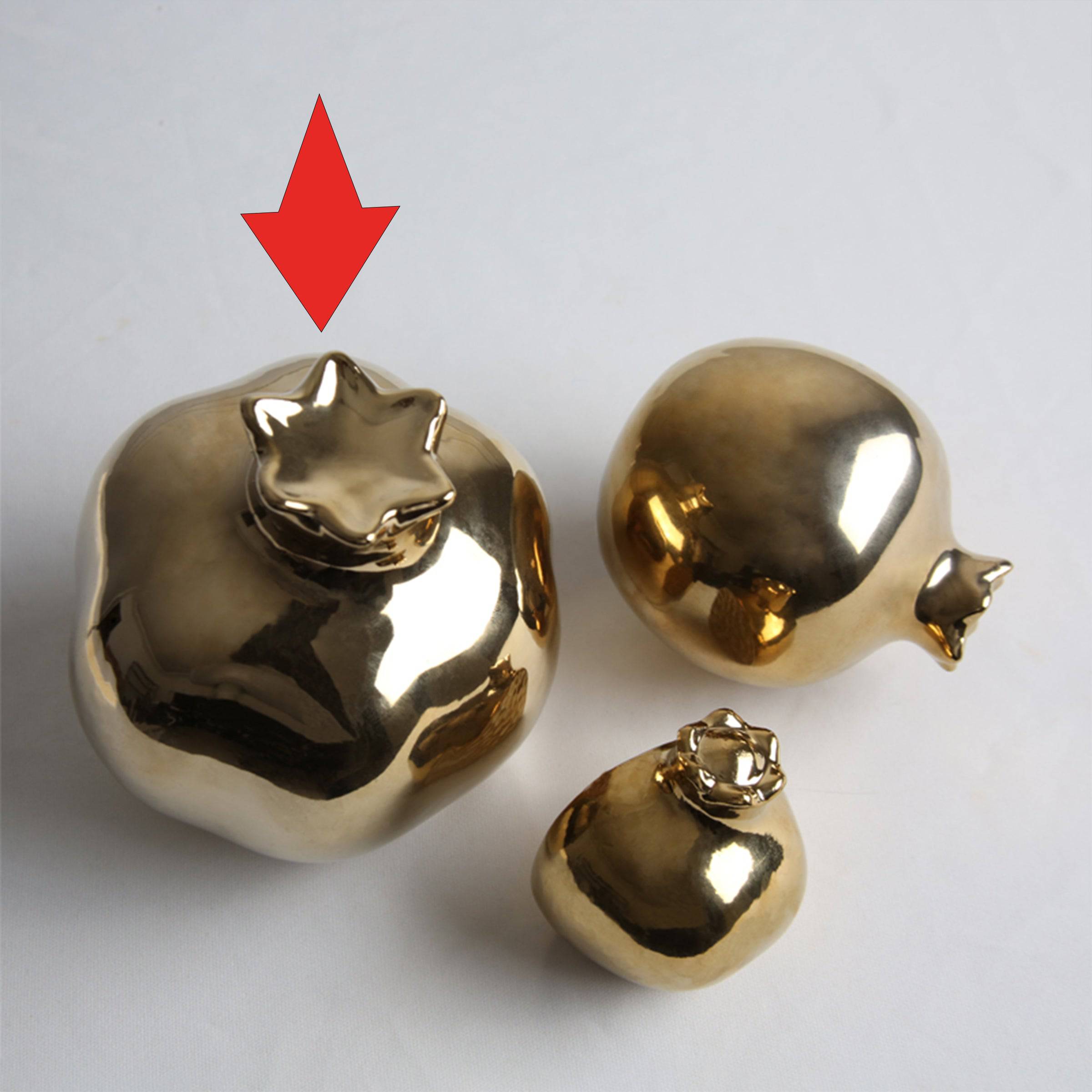 Golden Pomegranate home décor figurine by BEACON, decorative gold-colored ornament for stylish interior accents.
