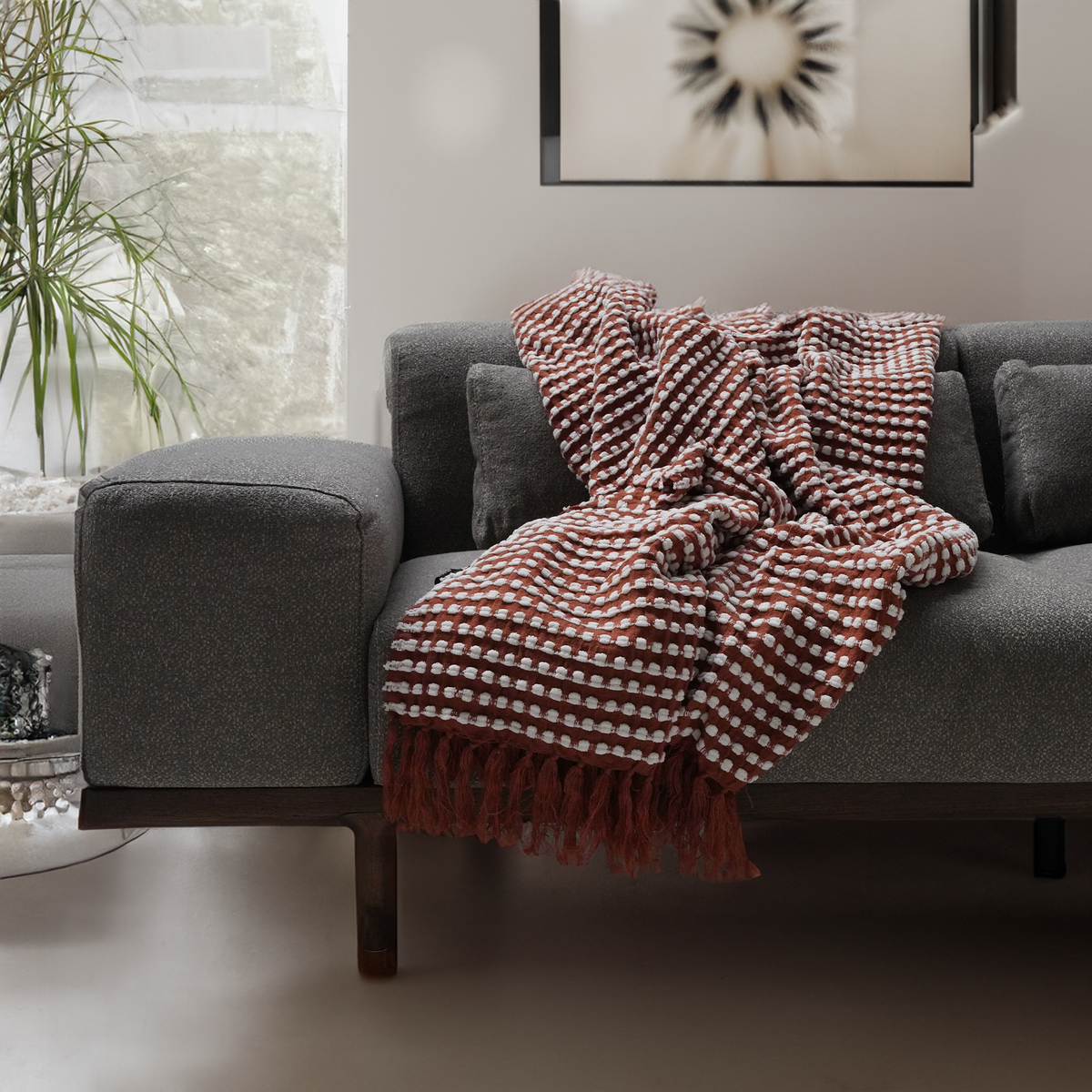 Handmade red throw blanket by BEACON, soft woven textile with a cozy, textured appearance perfect for home decor.