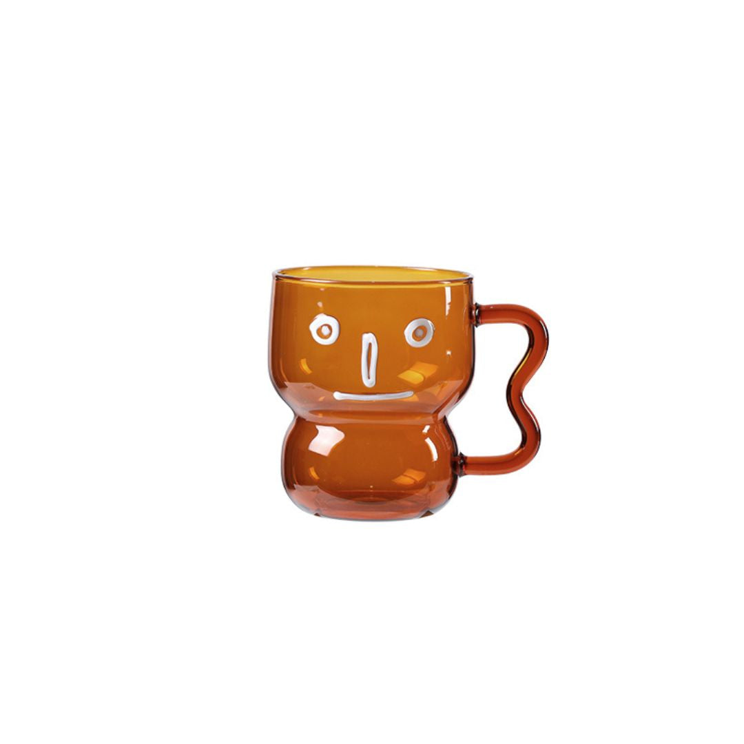 Human face ceramic cup from BEACON drinkware collection, featuring detailed facial design and ergonomic handle.
