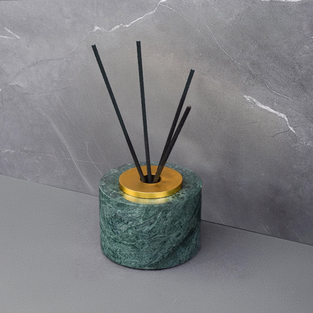 Indian green marble circular incense diffuser with bright gold accents, designed for stick diffusers by BEACON.