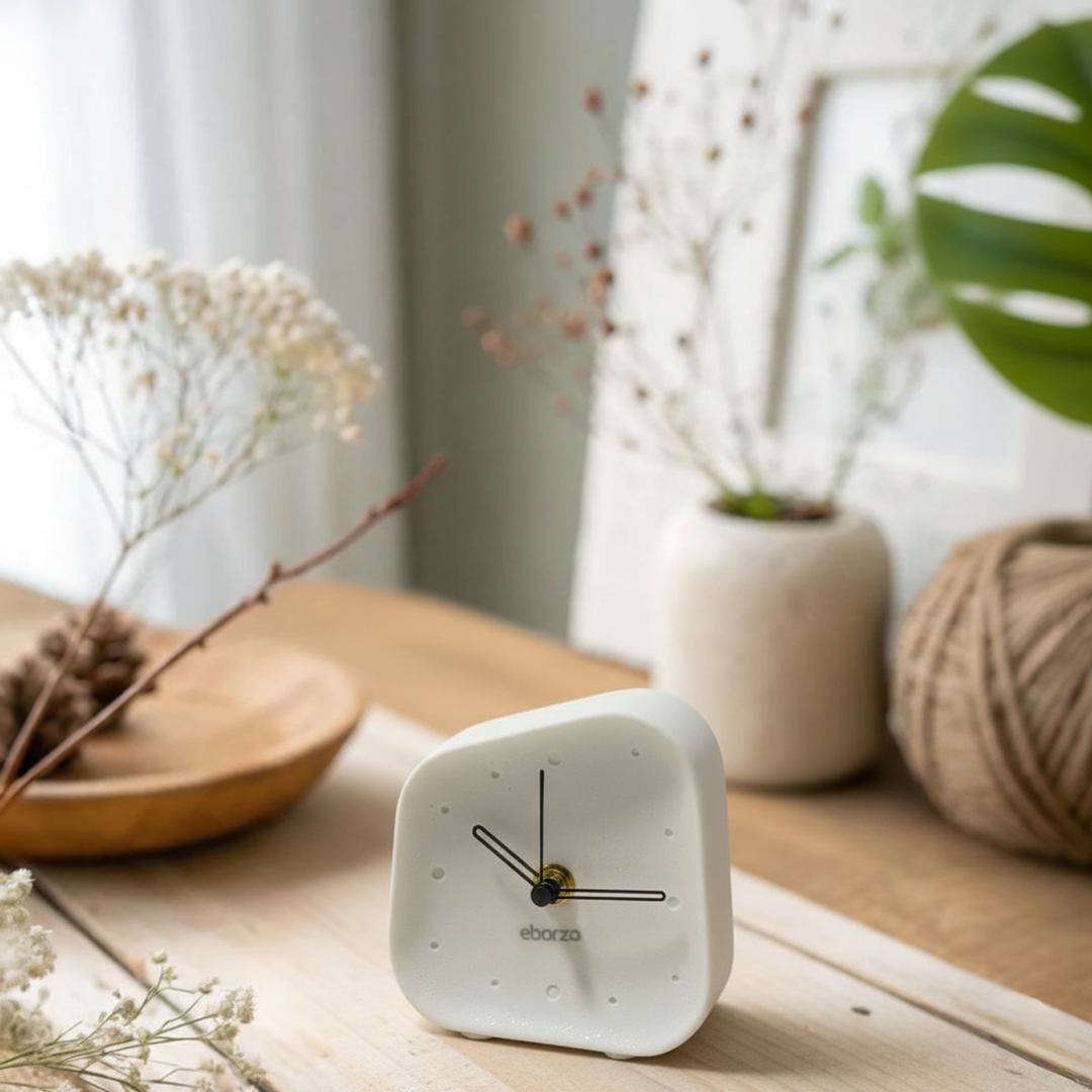 Ivory white square desk clock from BEACON with black hour and minute hands, modern design, and clear time display.
