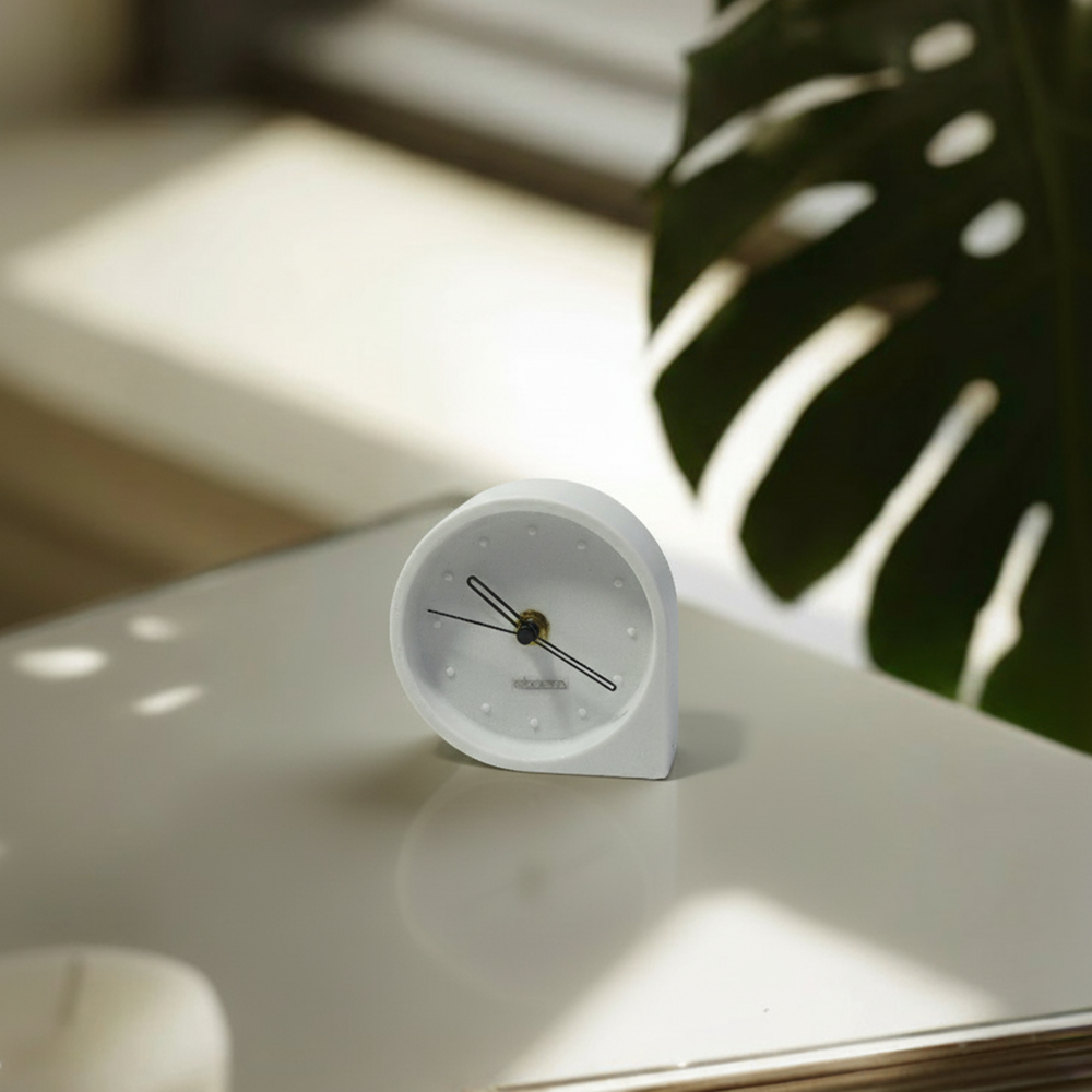 Ivory white water drop-shaped desk clock by BEACON, TCD284, with a sleek modern design and clear time display.